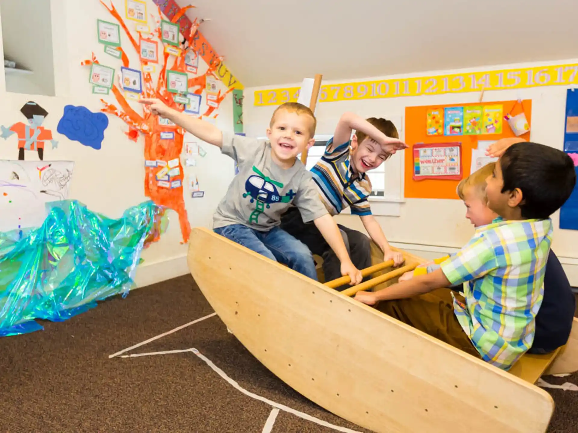 a group of kids playing with a rope