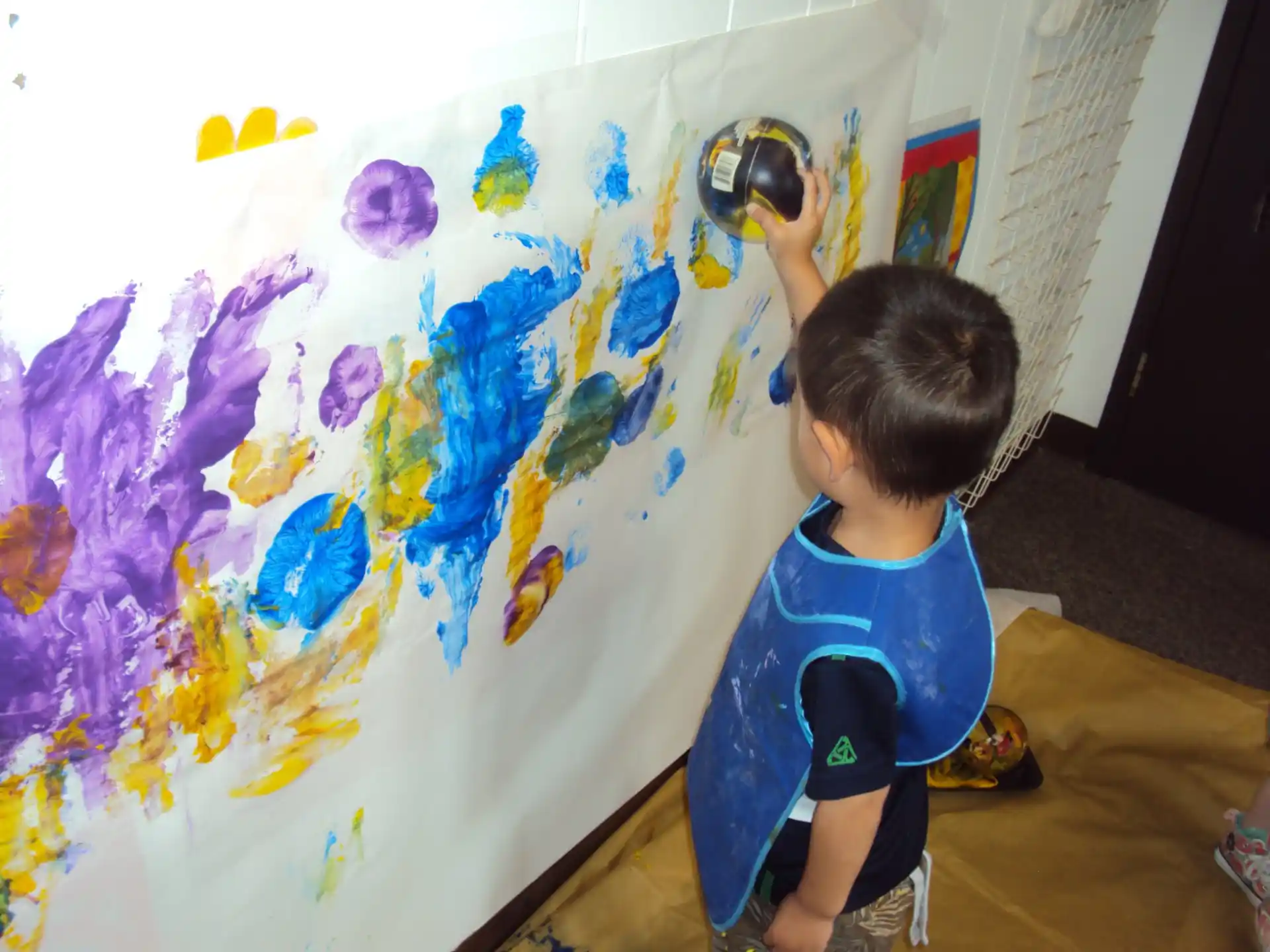 a child painting on a wall