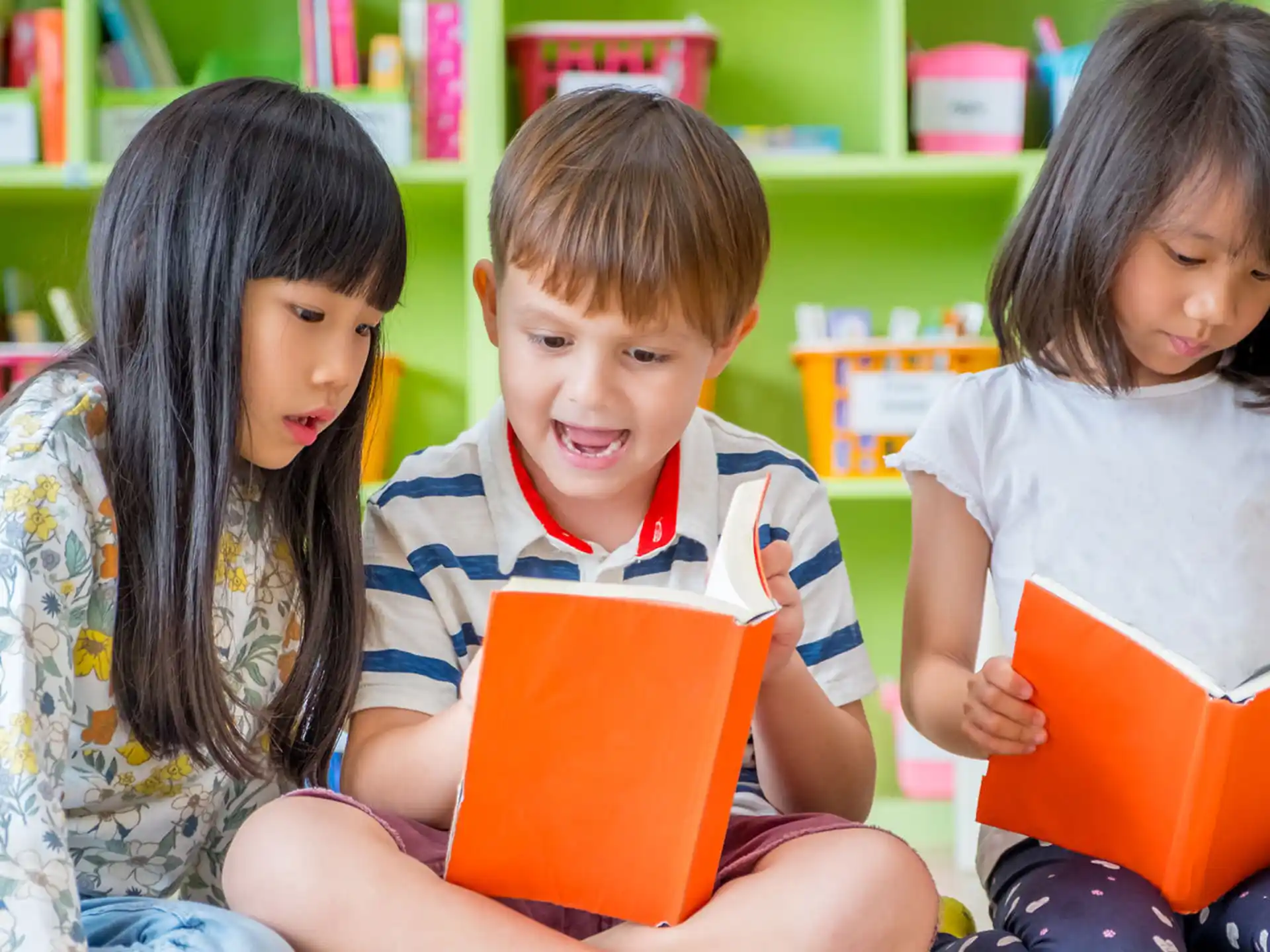 a group of children reading books
