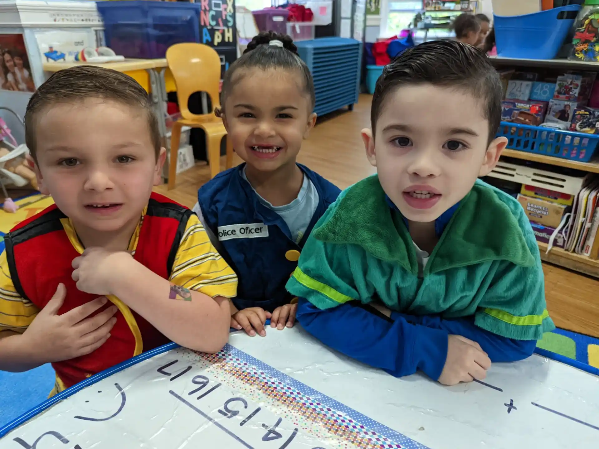 a group of boys sitting at a table