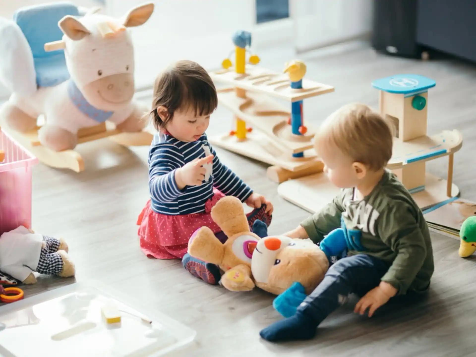a couple of children playing with toys