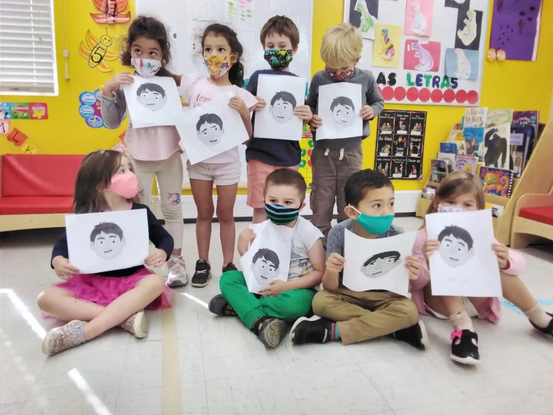 a group of children sitting on the floor