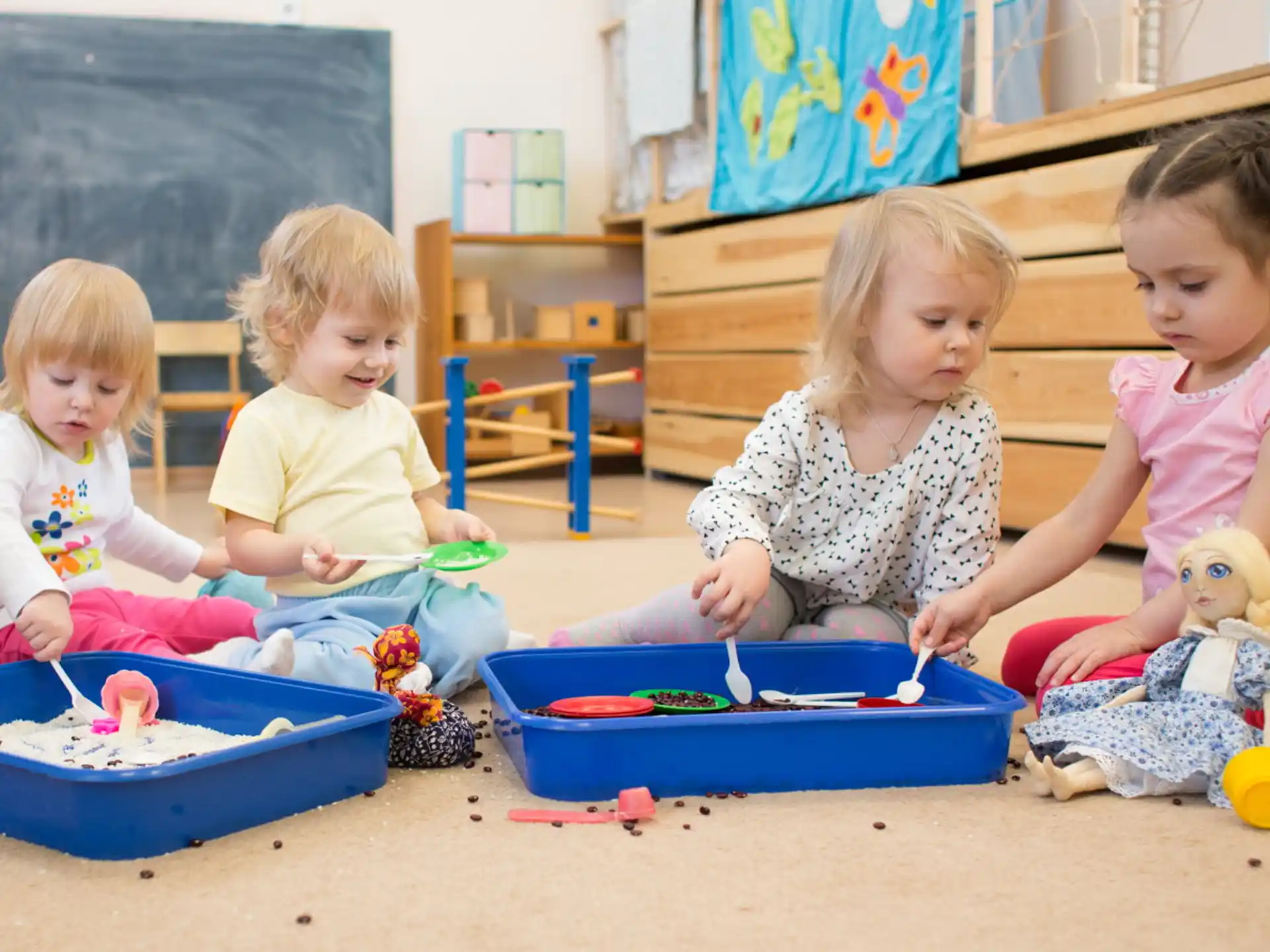 a group of children playing with toys