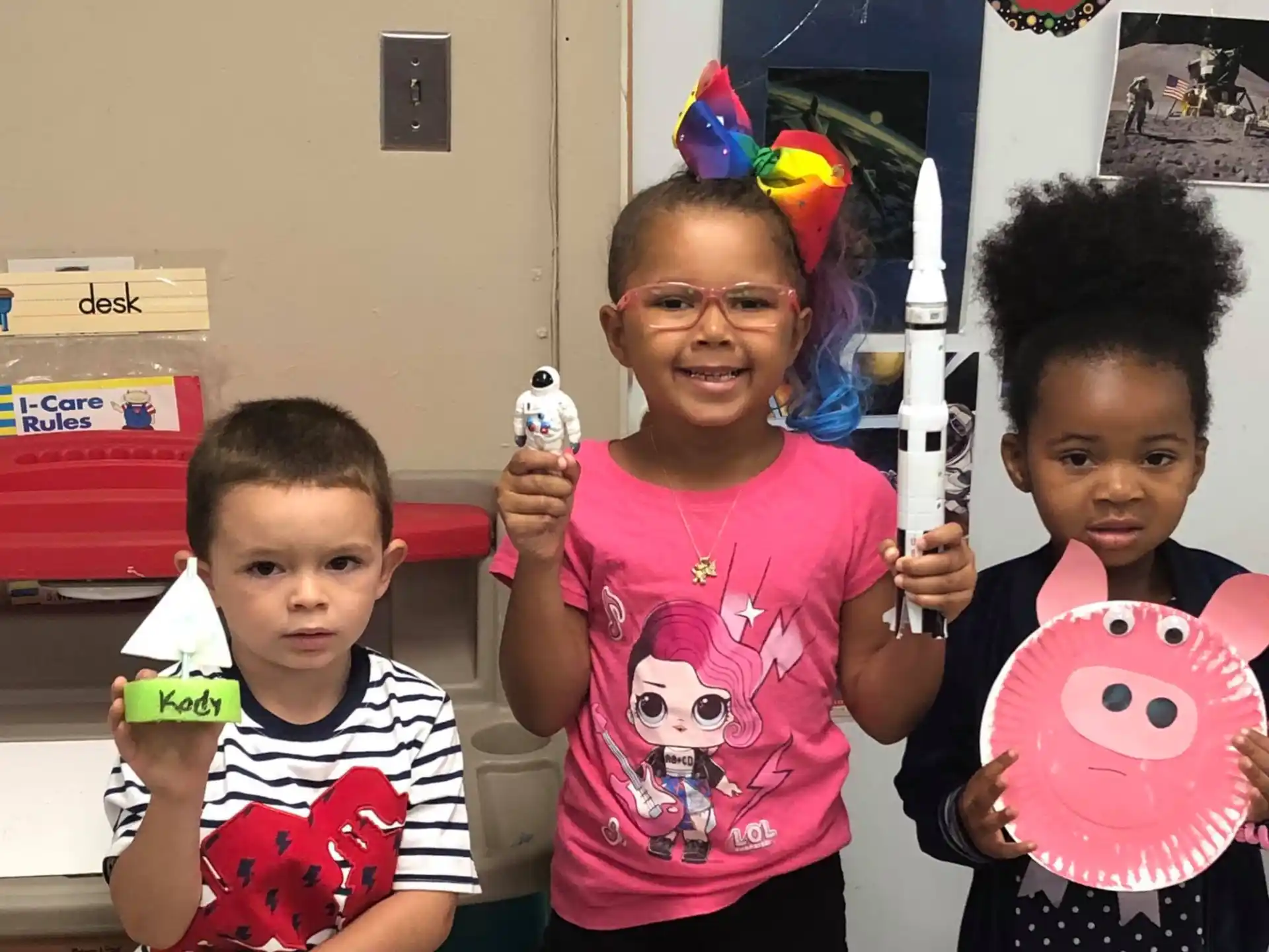 a group of children holding toys