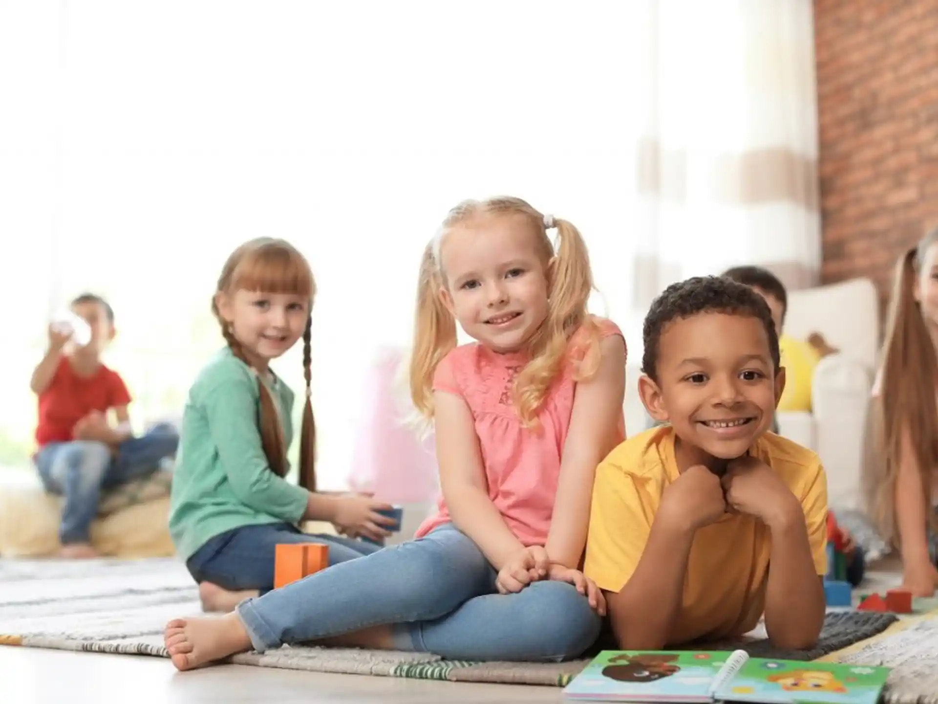 a group of children sitting on the floor