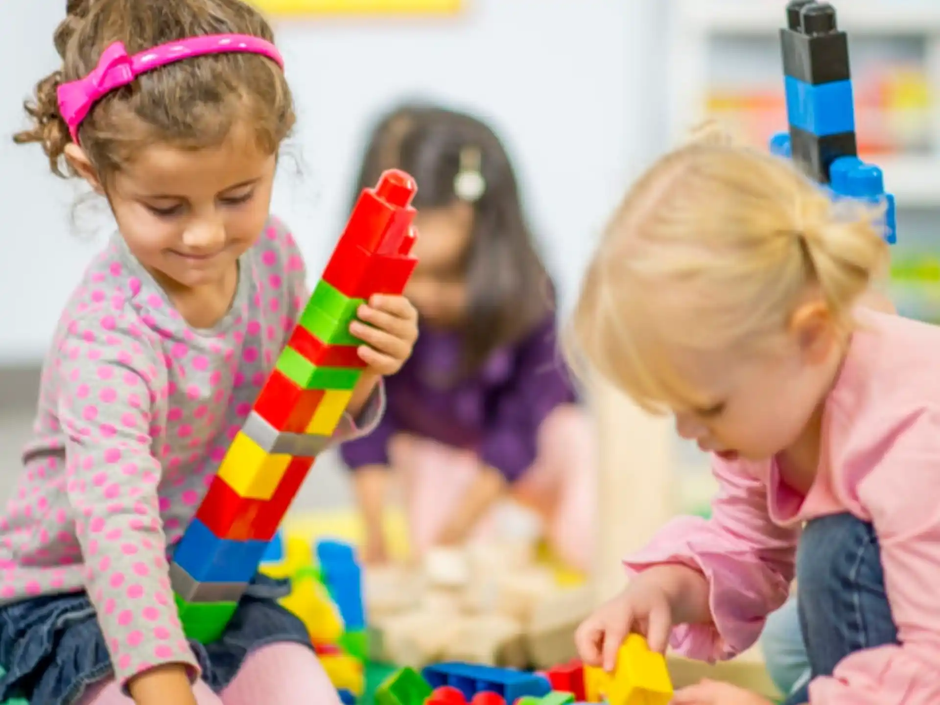 a group of children playing with toys