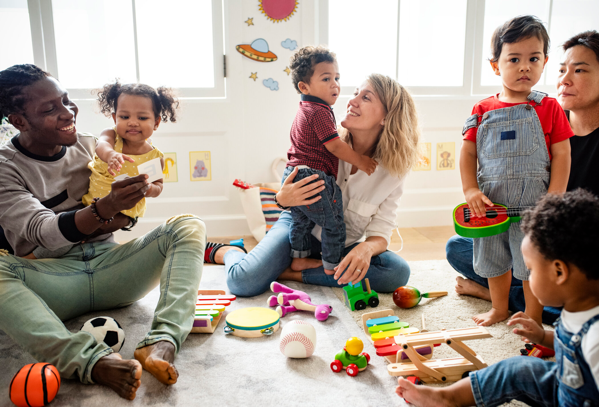 a group of people playing with toys