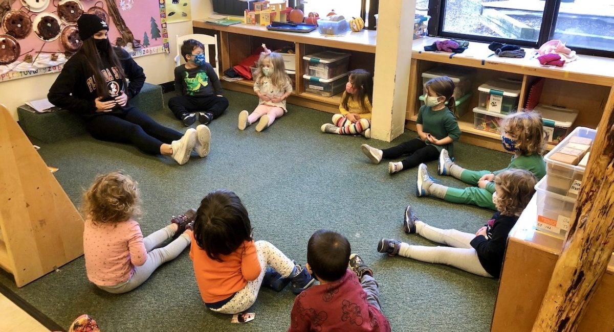 a group of children sitting on the floor