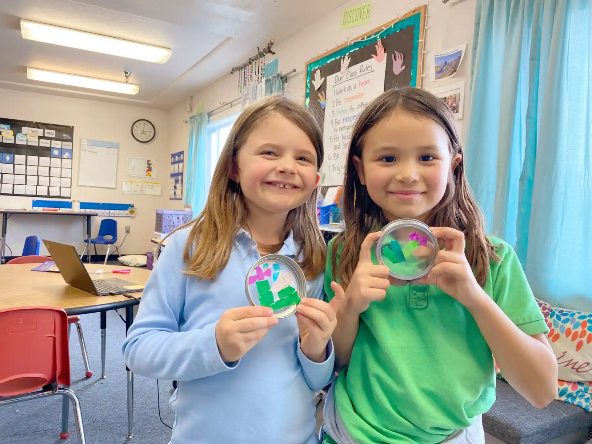 a couple of girls holding a toy