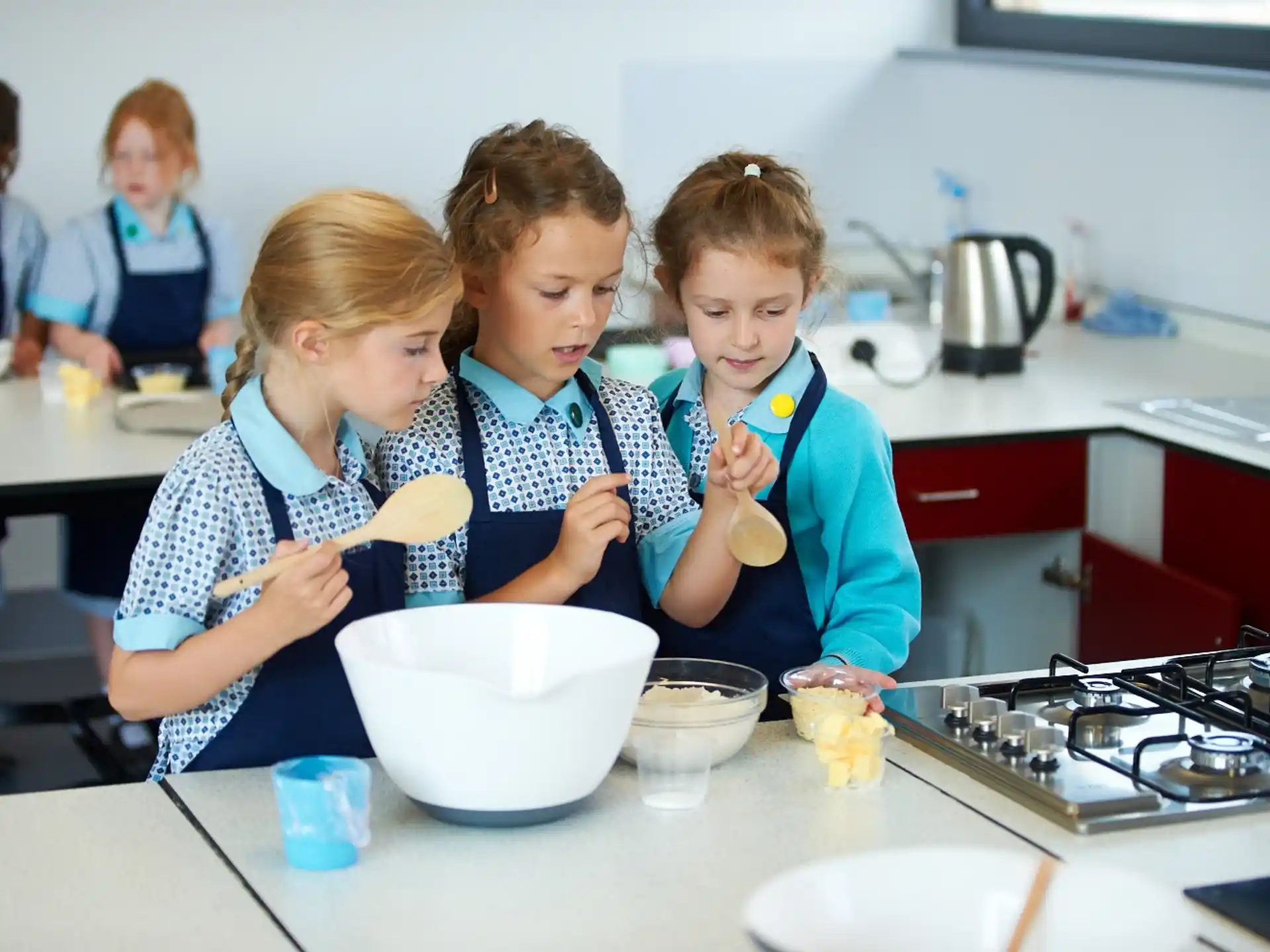a group of children making ice cream