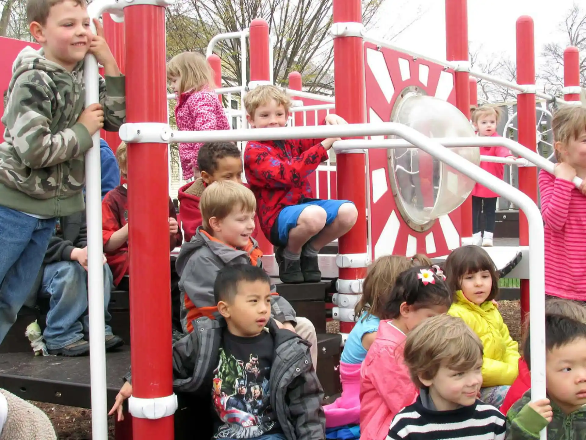 a group of children playing on a playground