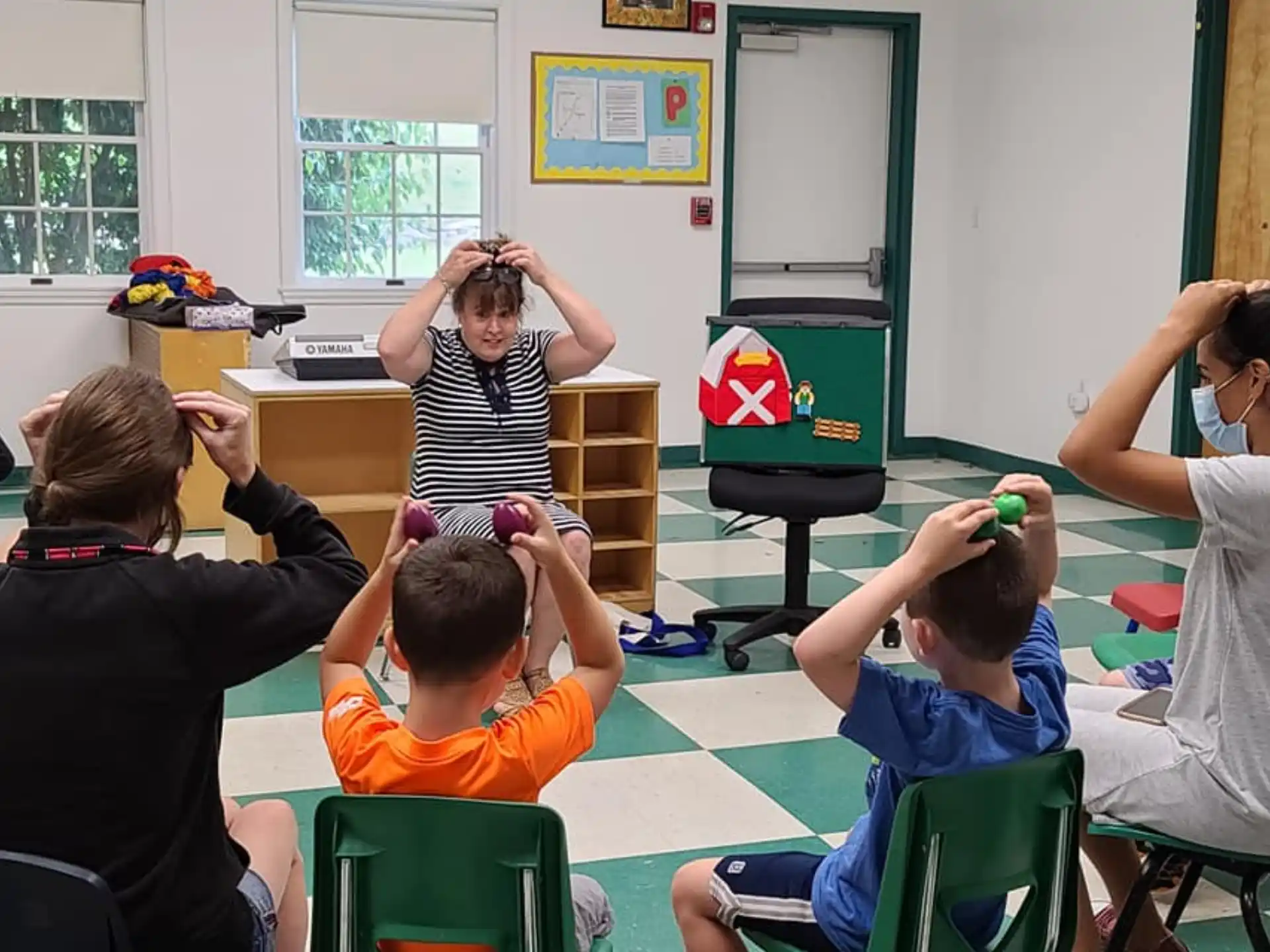 a group of people sitting in a classroom