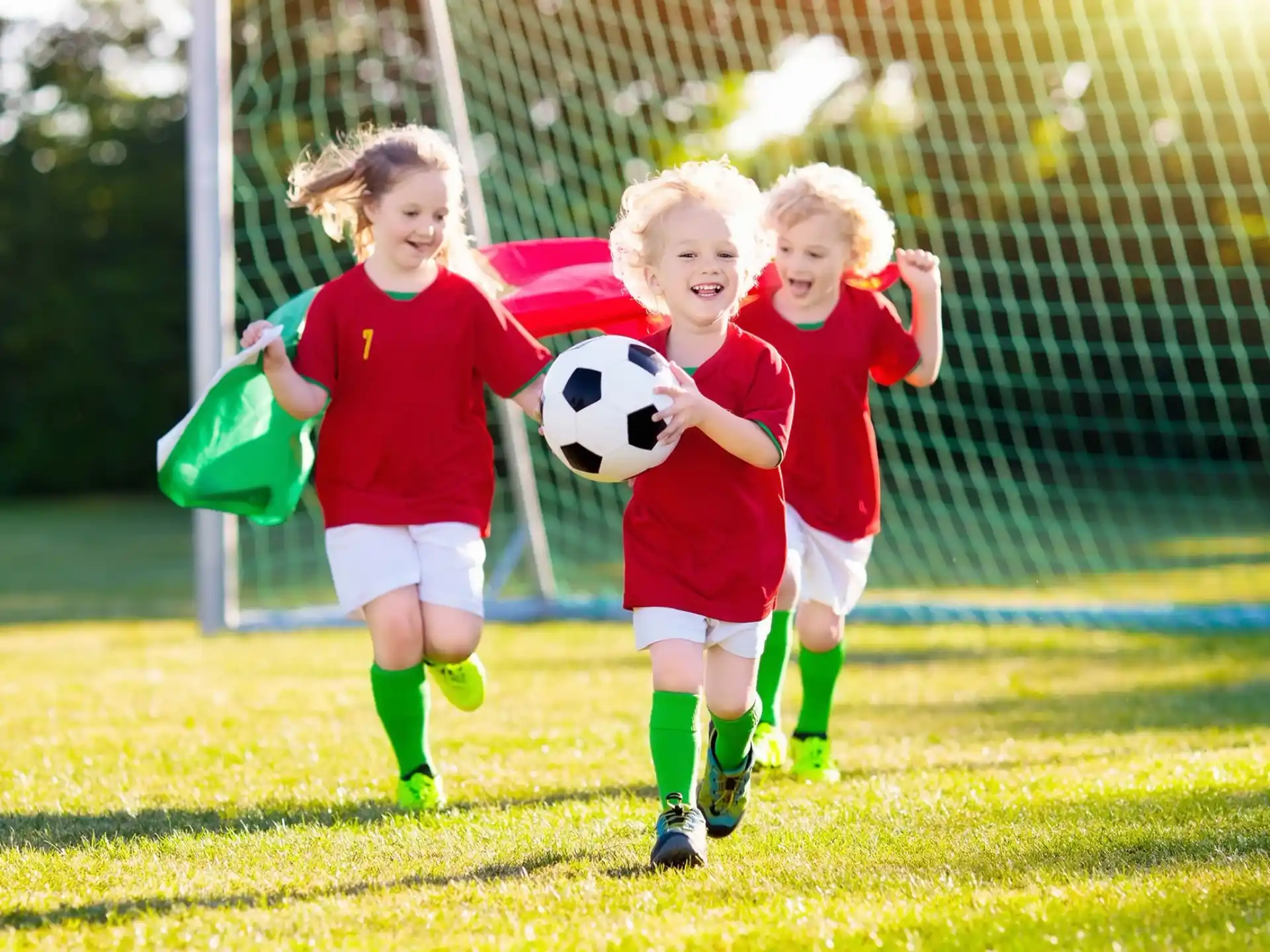 a group of young girls playing football
