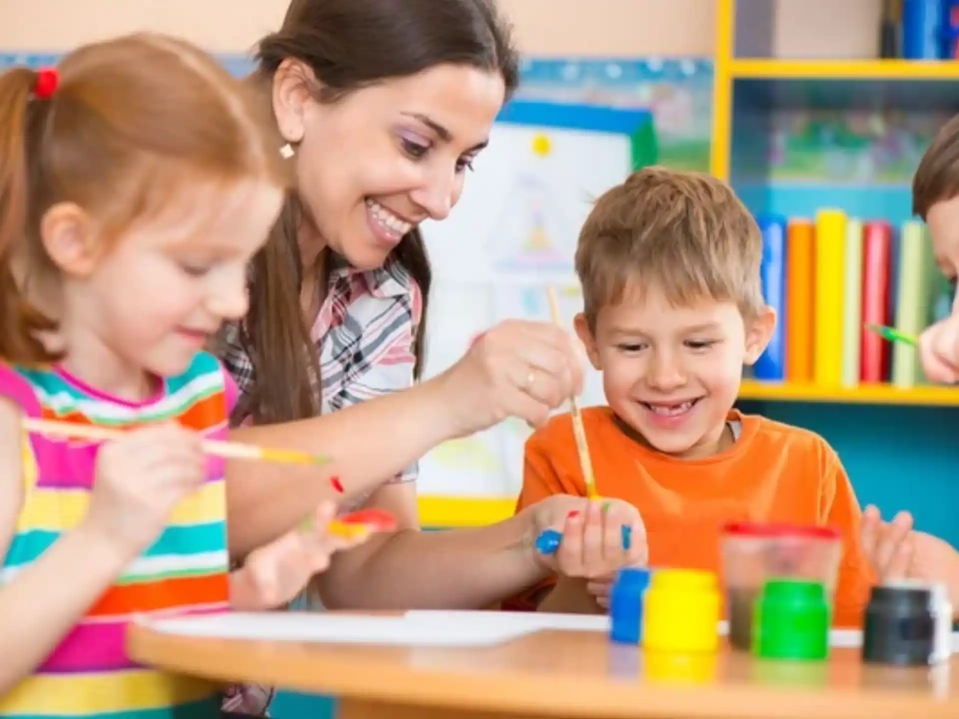 a person and children playing with toys