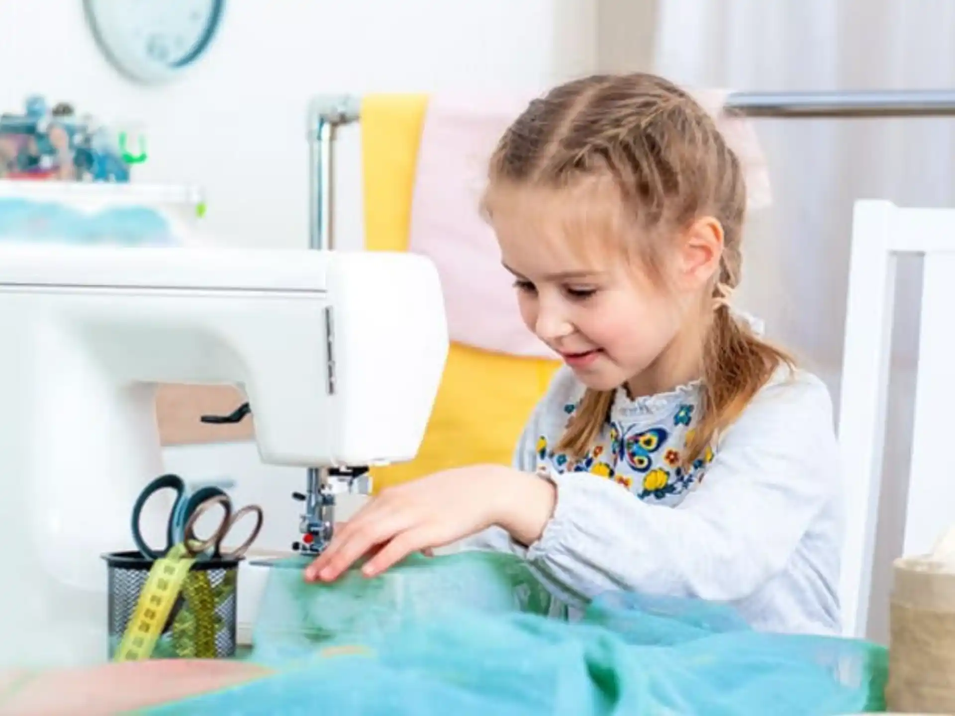 a little girl using a computer