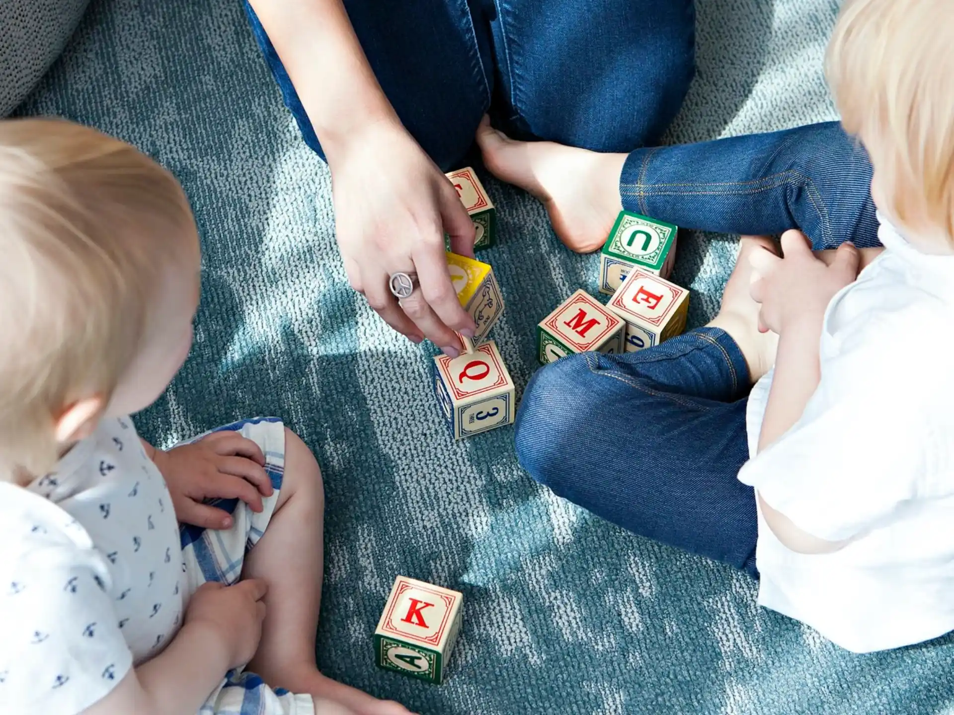 a group of people playing with cards