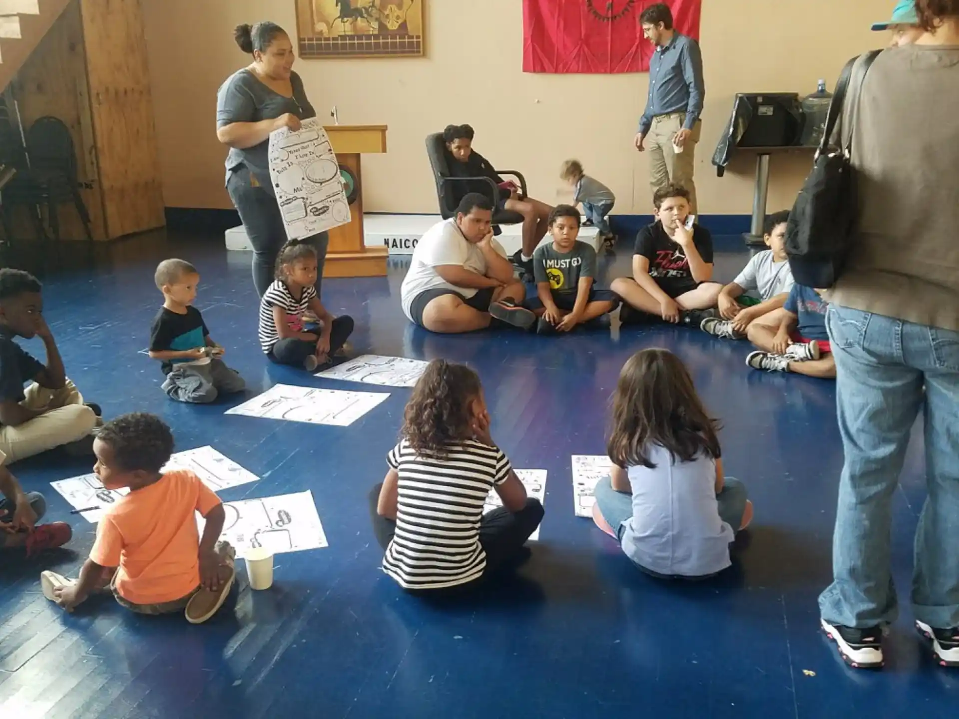 a group of children sitting on the floor