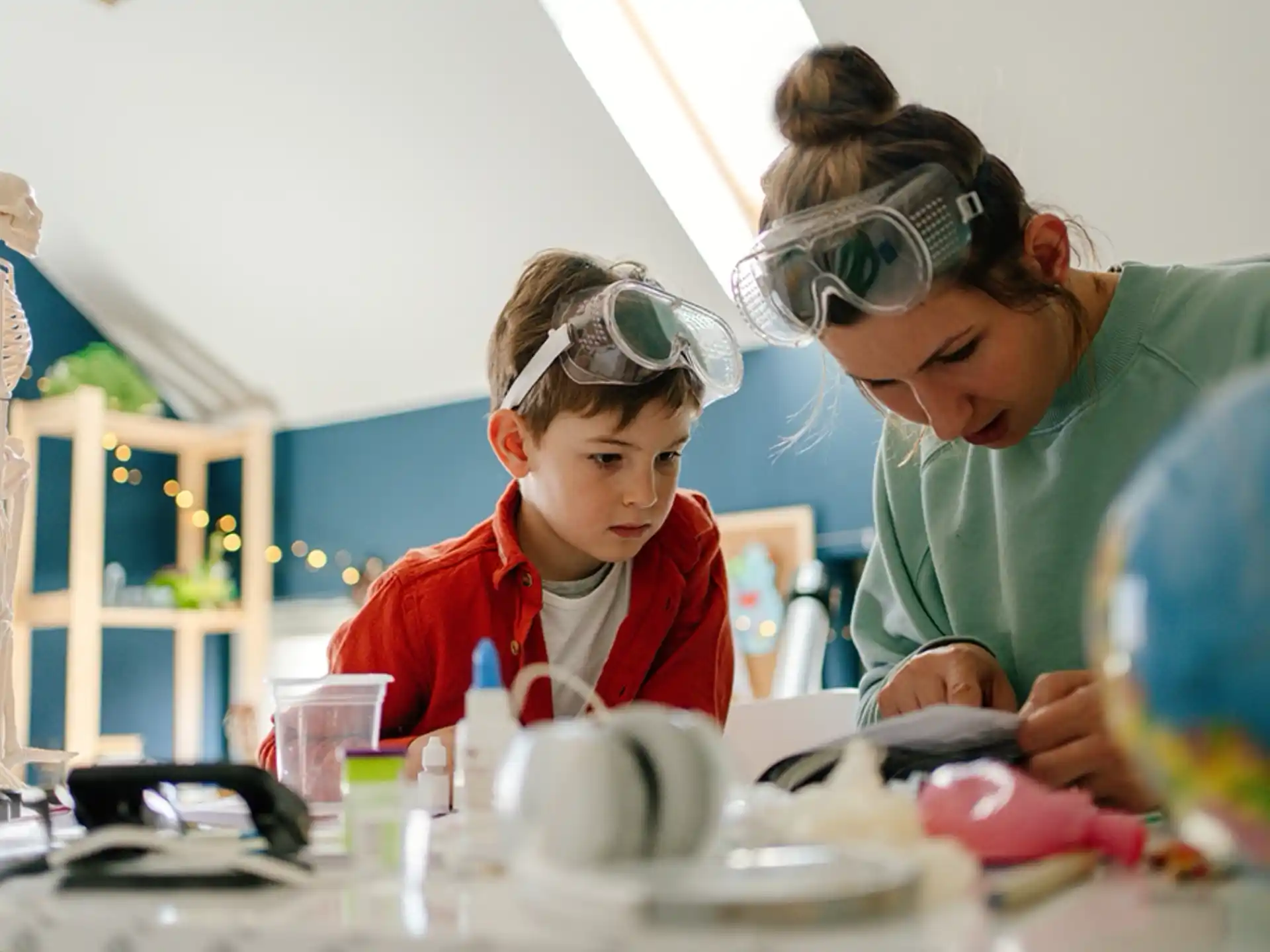 a person and a child looking at a microscope
