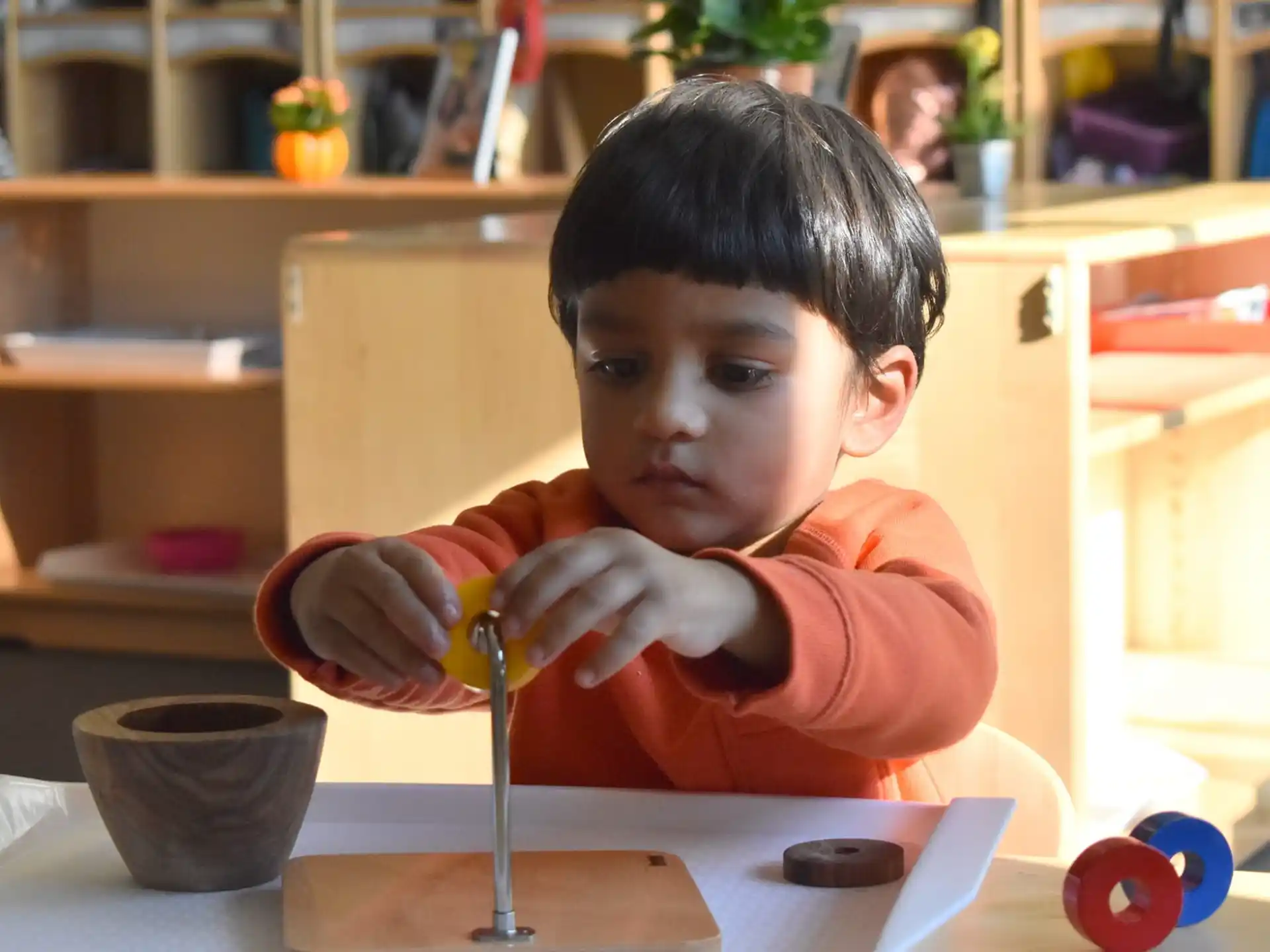 a child sitting at a table