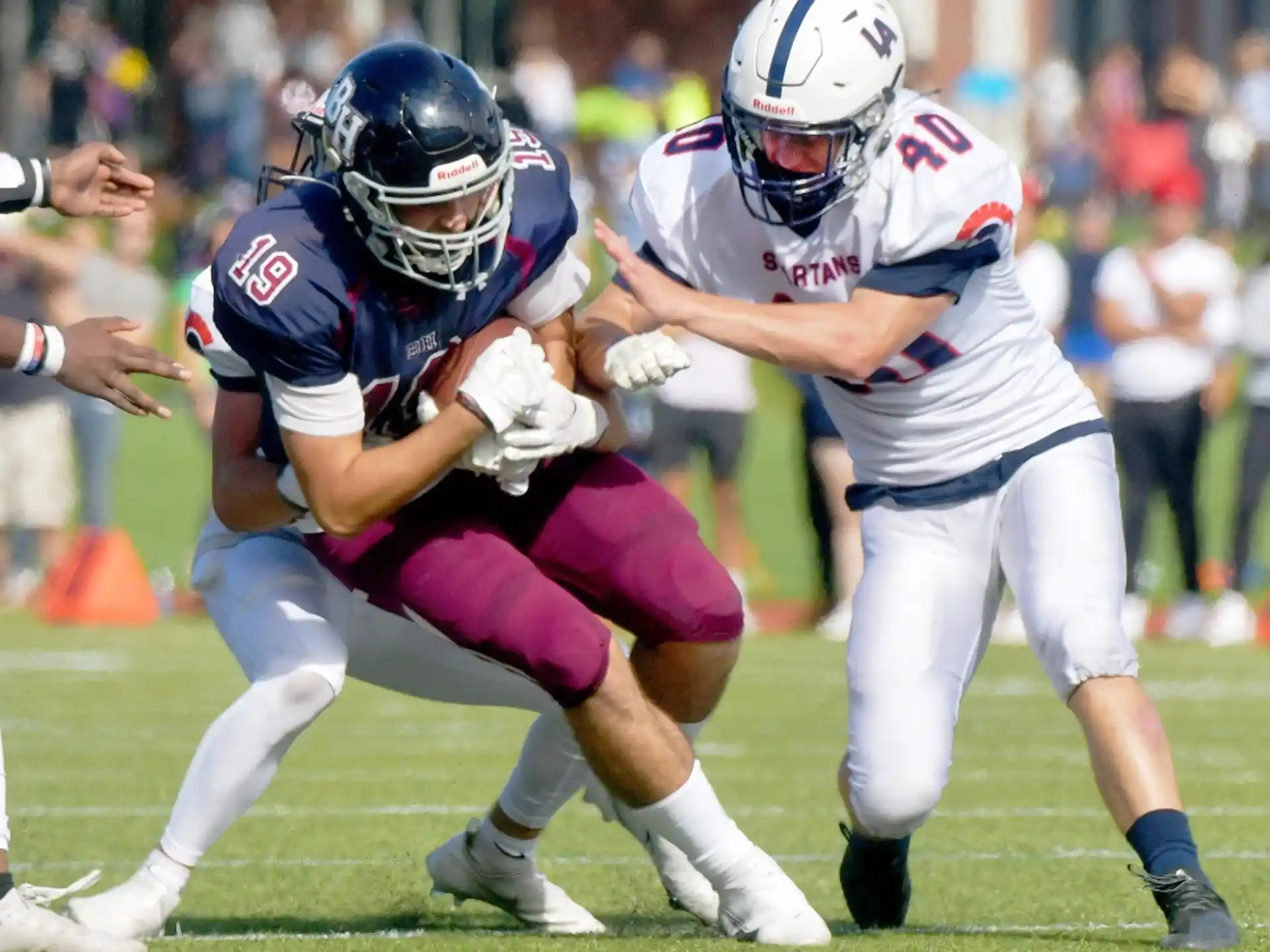a couple of men playing football