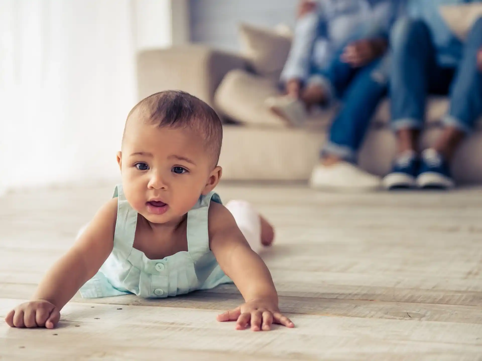 a baby crawling on the floor