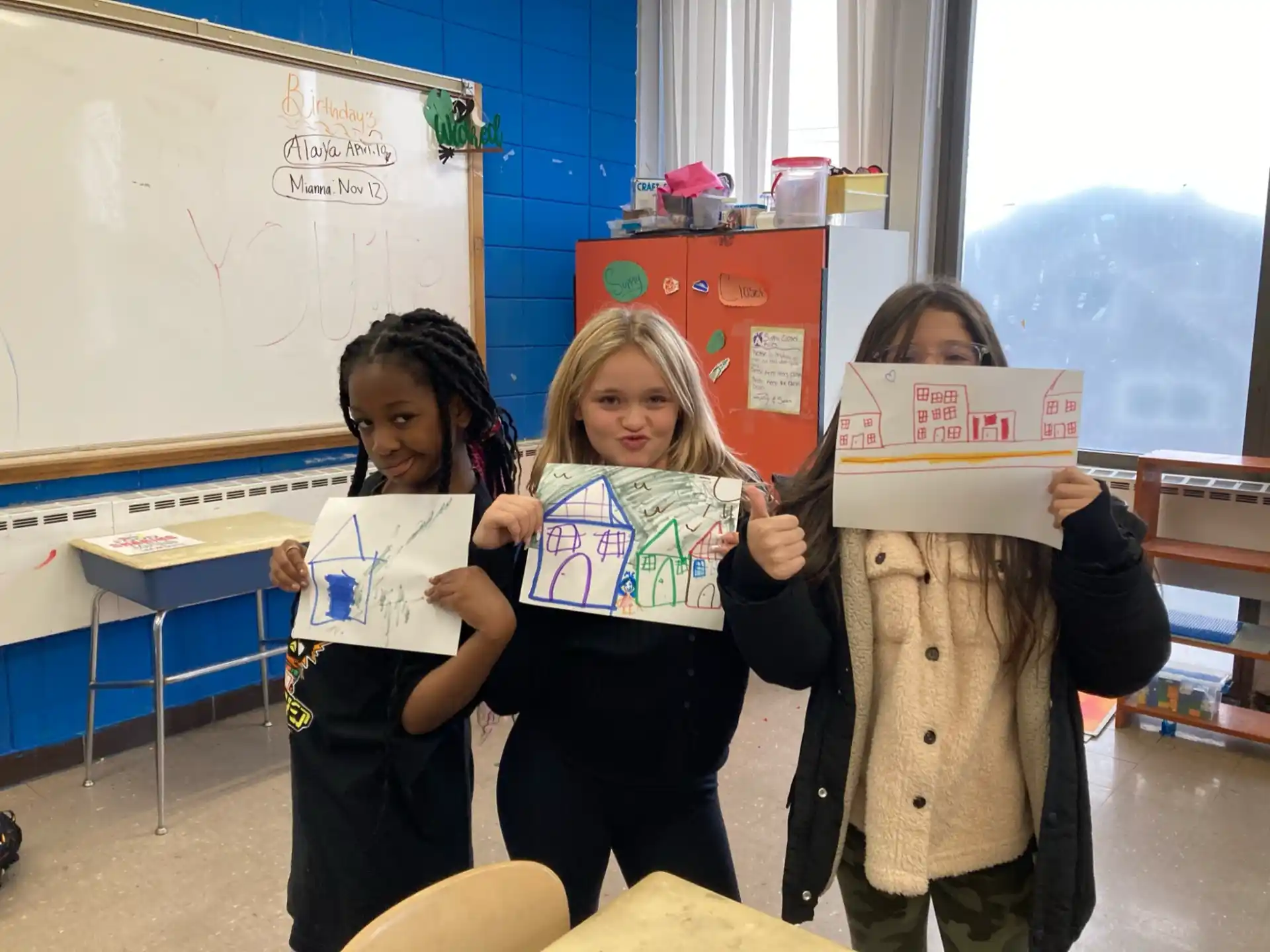 a group of children holding up signs
