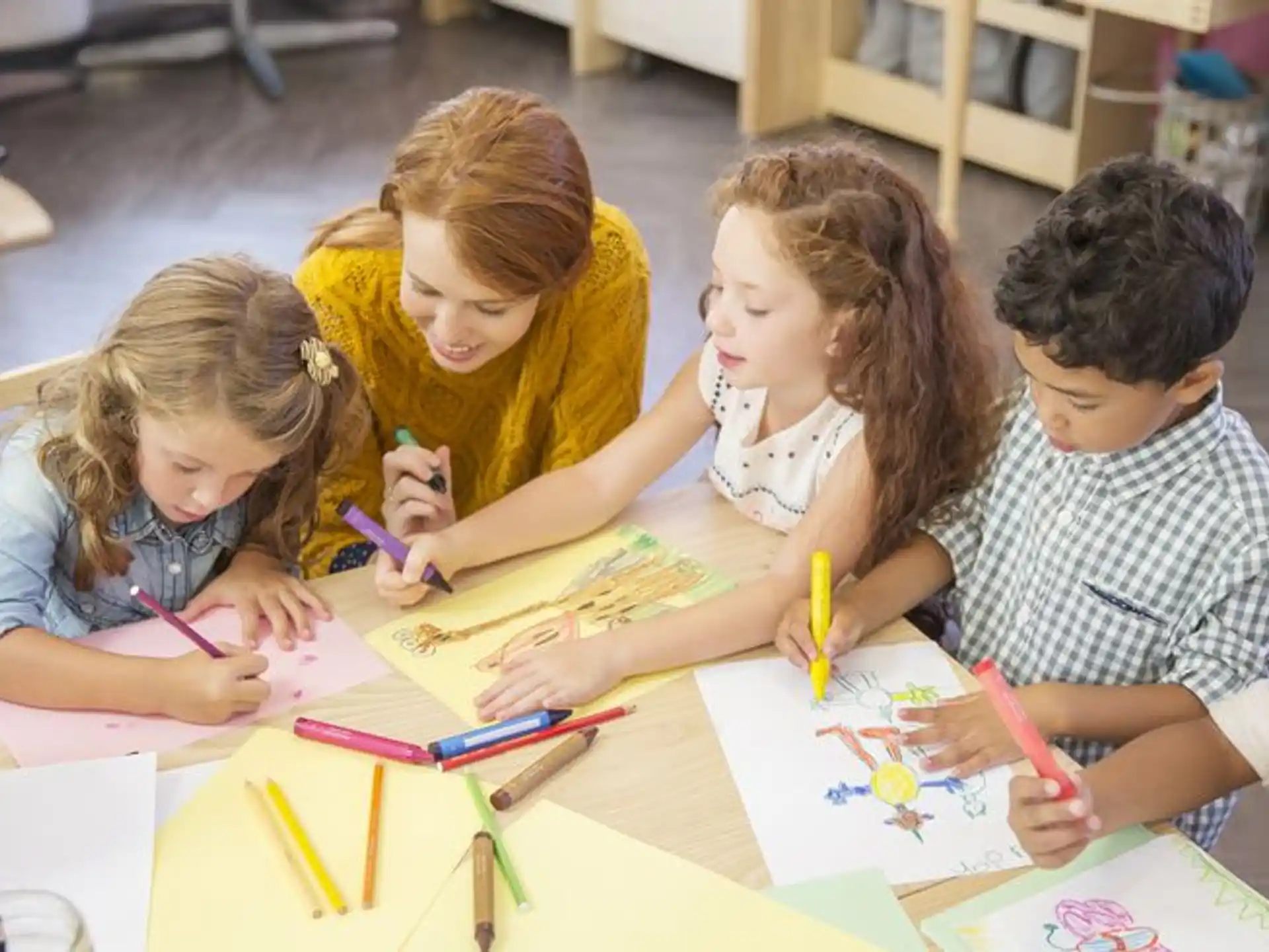 a group of children coloring