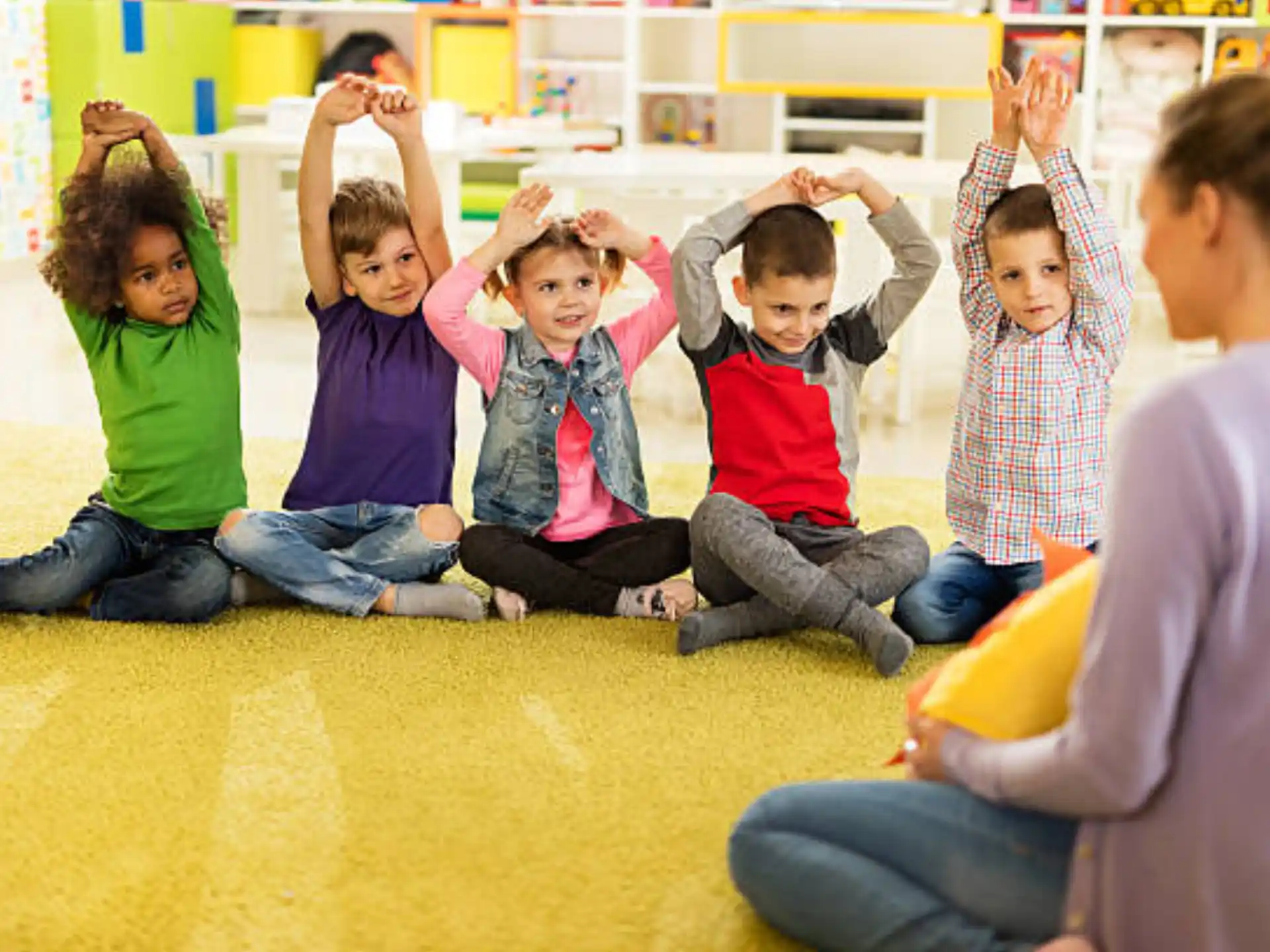 a group of children sitting on the floor