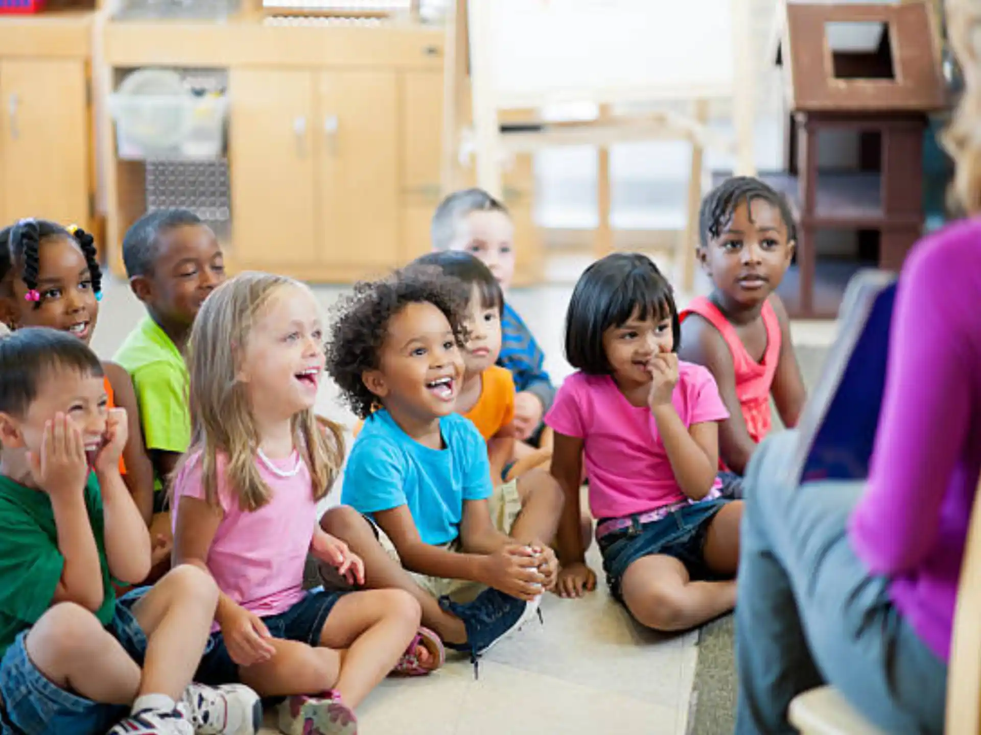 a group of children sitting on the floor