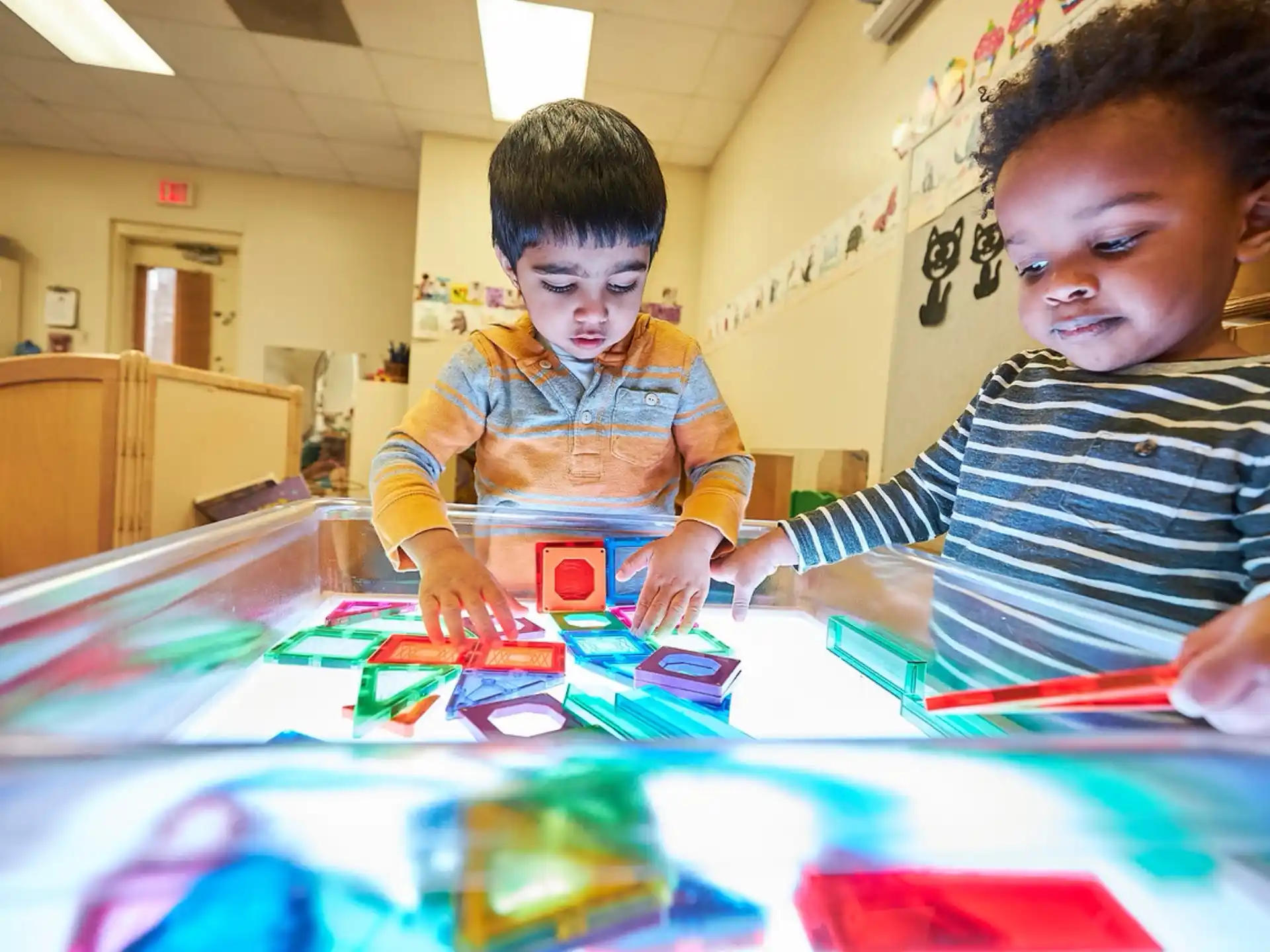 a couple of boys playing a board game
