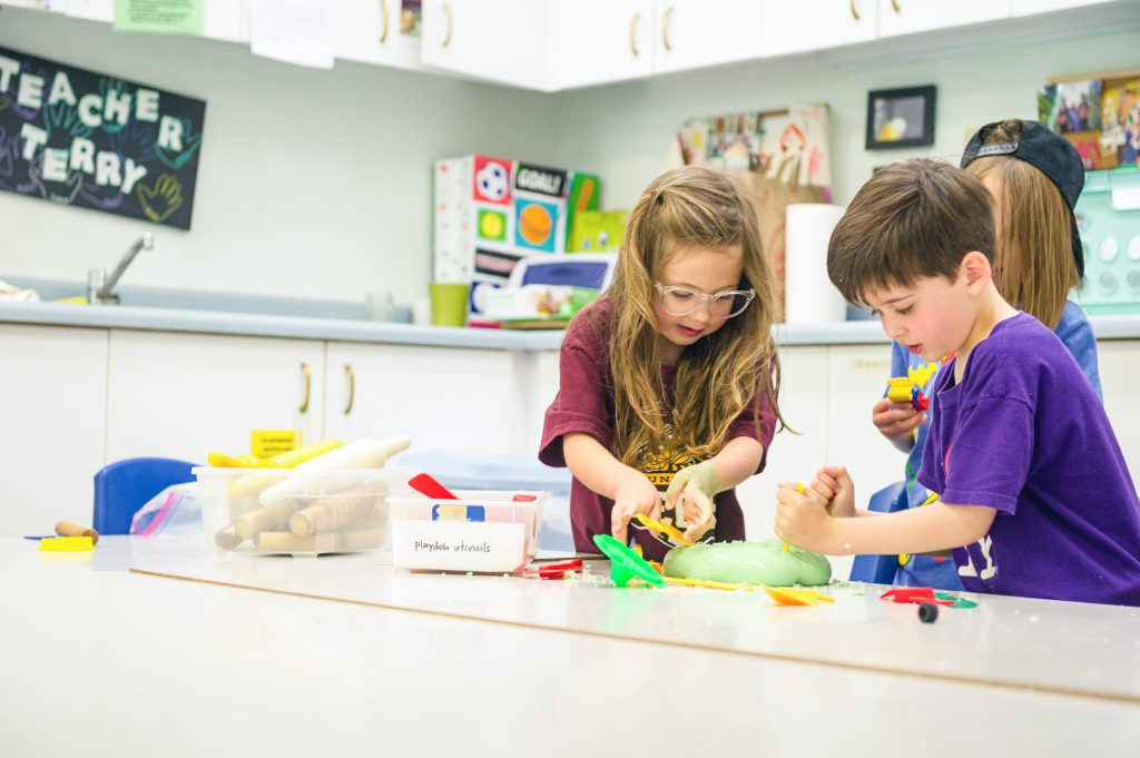a few children playing with toys