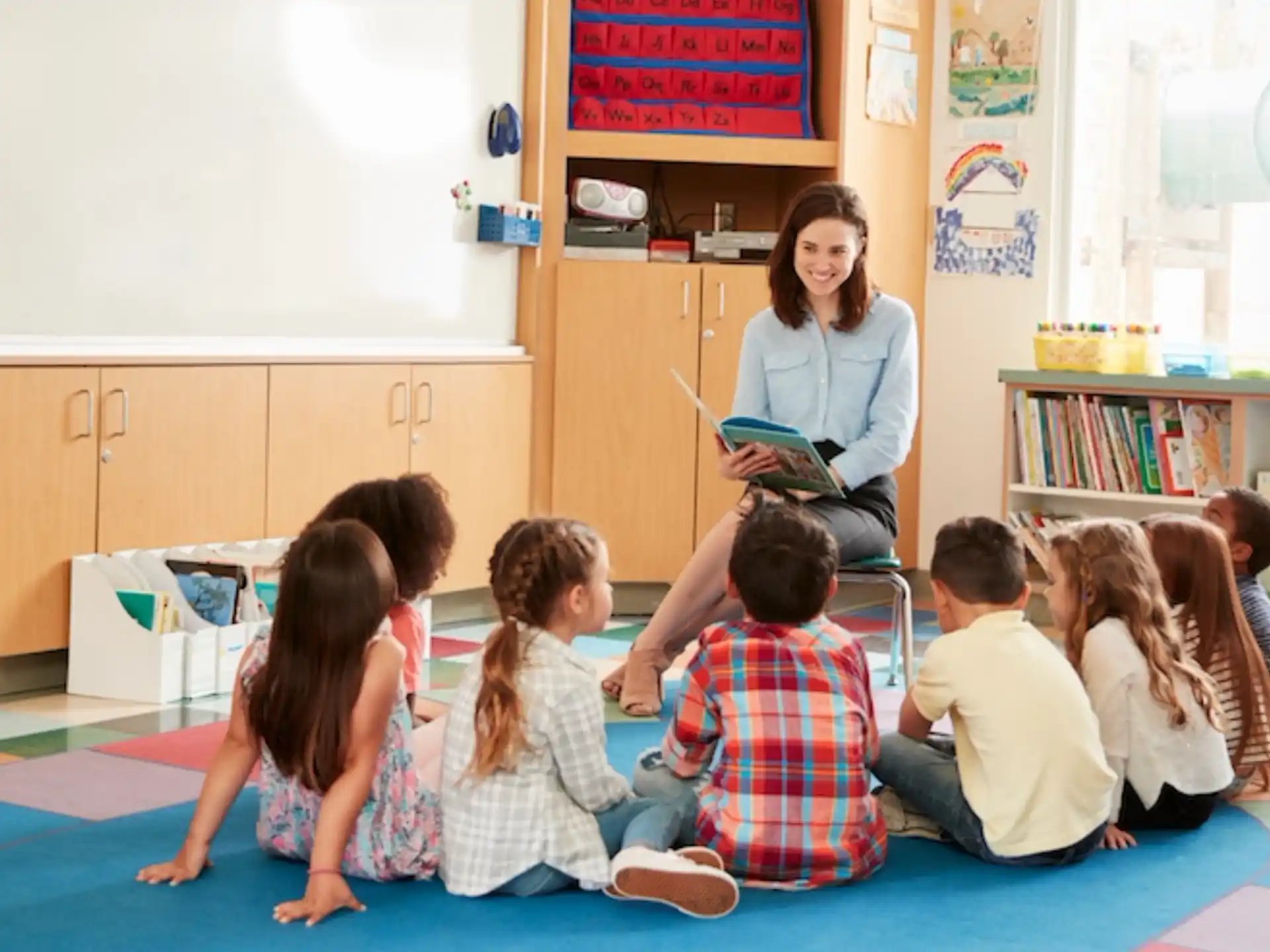 a person teaching a group of children