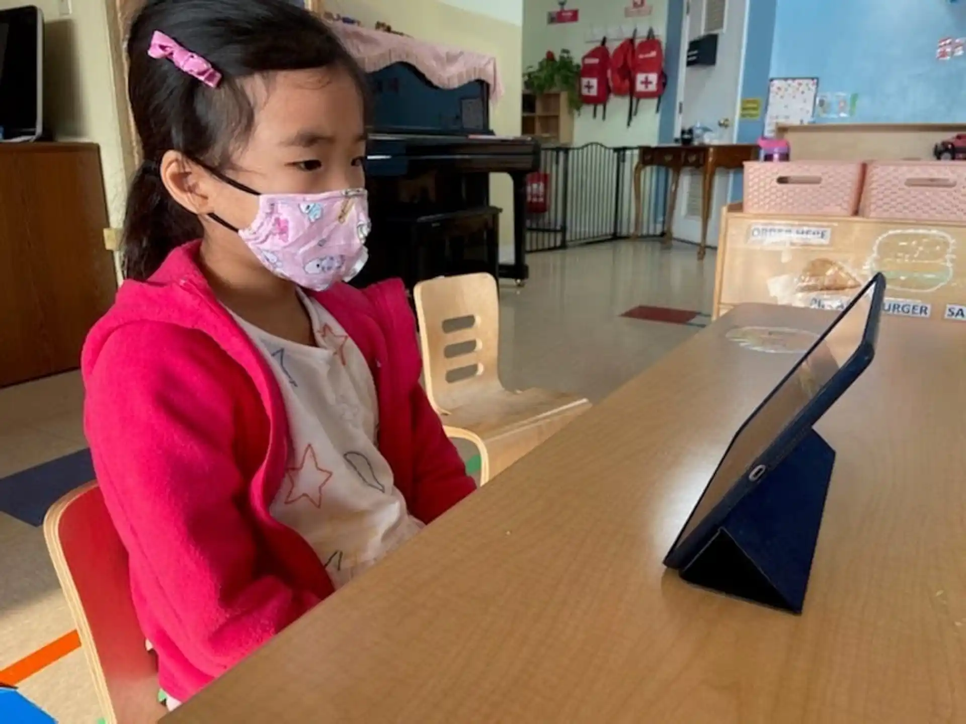 a young girl with a face mask