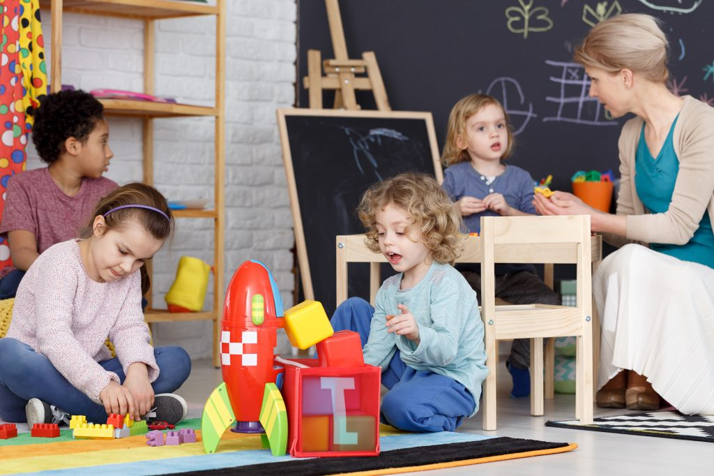 a group of children playing with toys