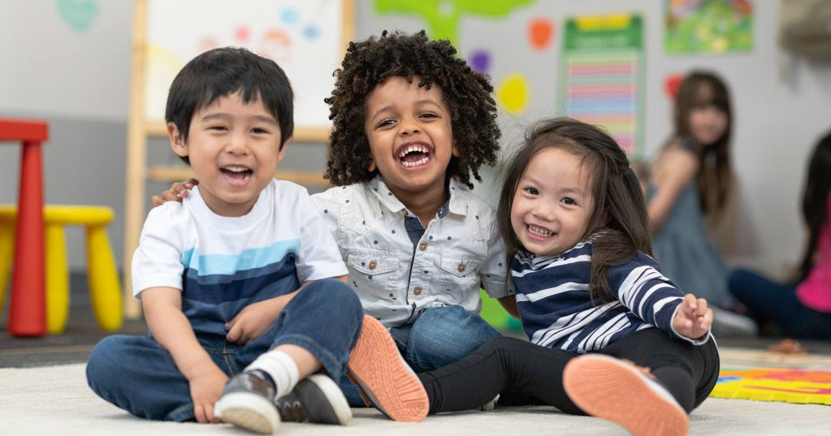 a group of children sitting on the floor