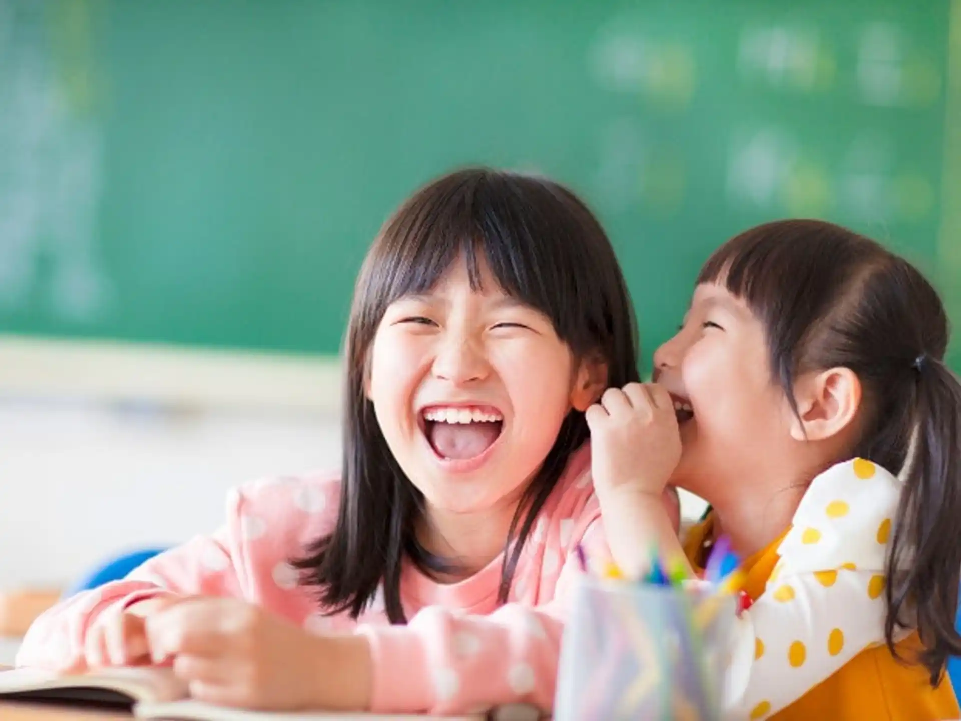 a few young girls laughing