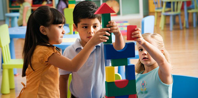 a group of children playing with toys