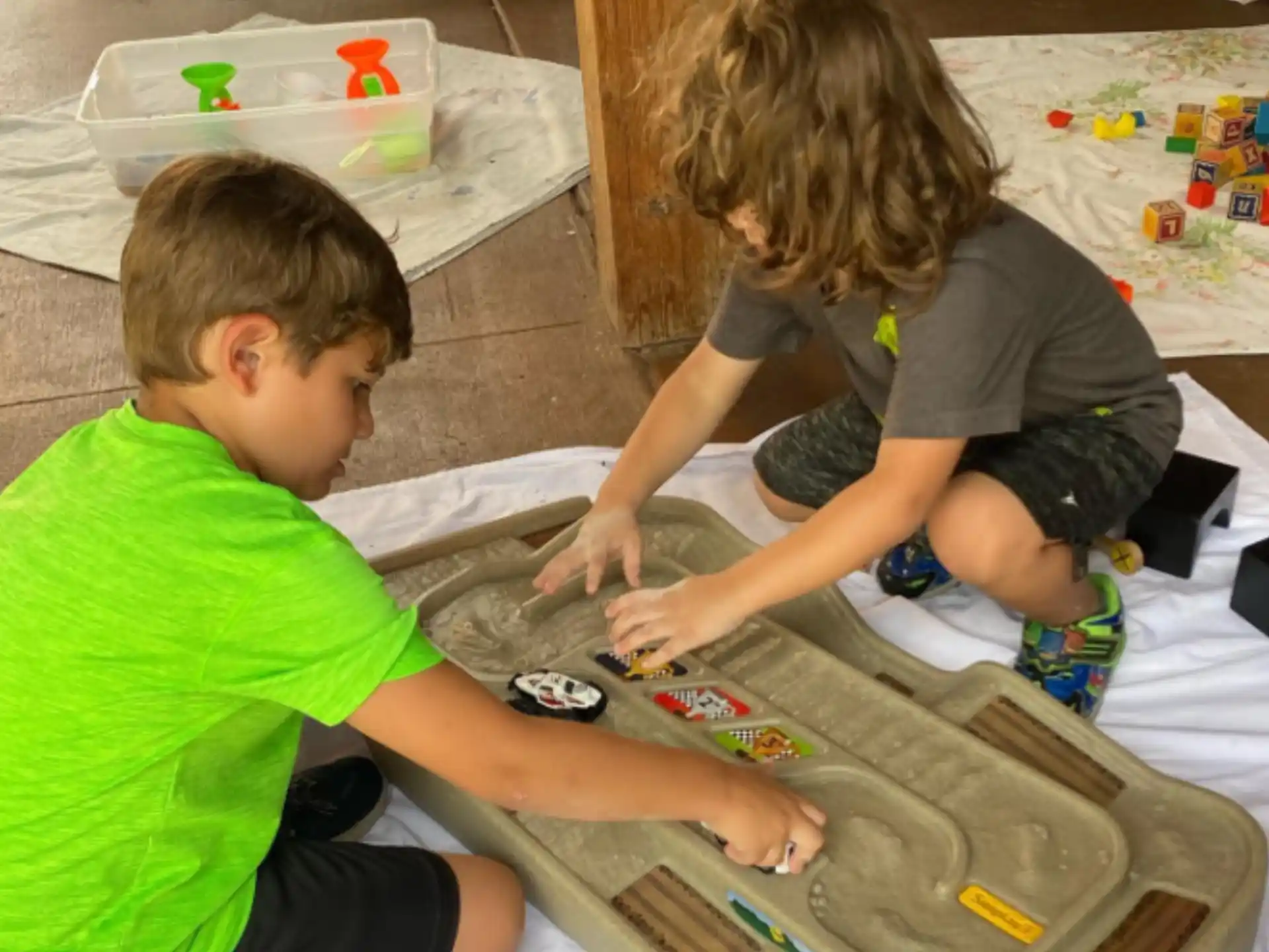 a couple of children playing with toys