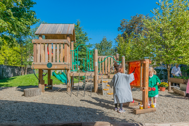 a person and a child playing on a playground