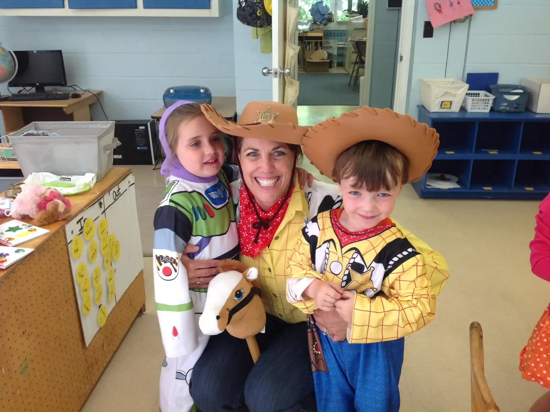 a person holding a couple of children