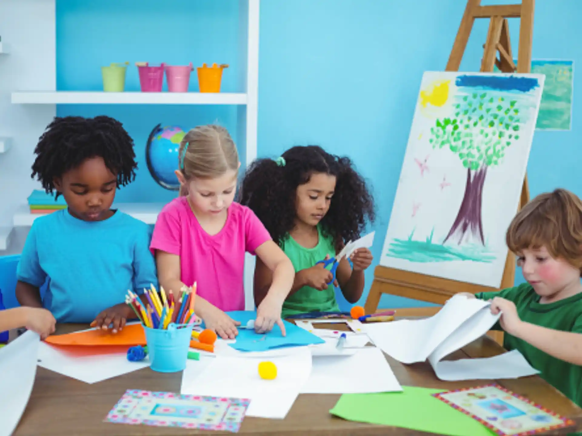 a group of children sitting at a table
