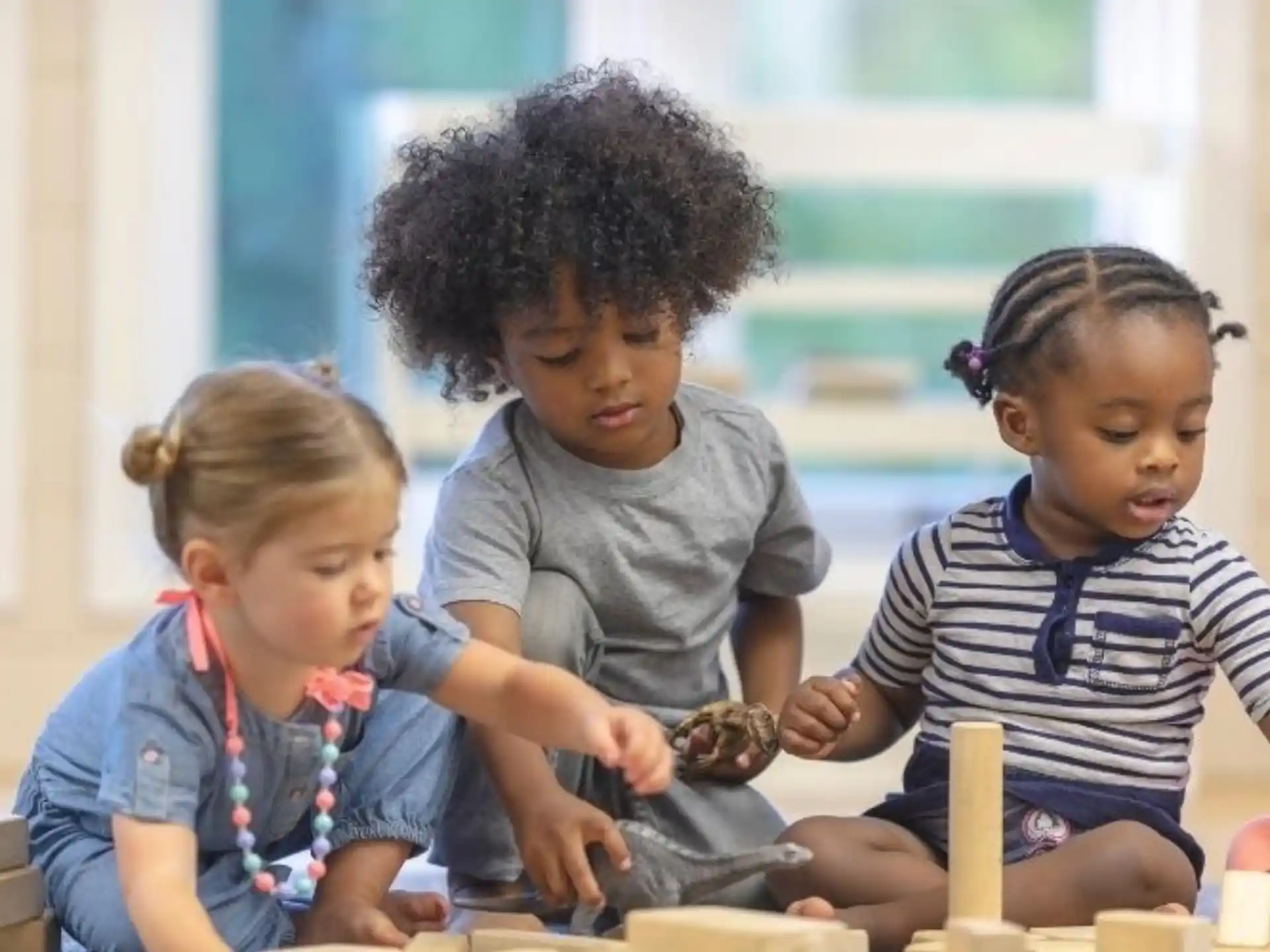 a group of children playing with toys