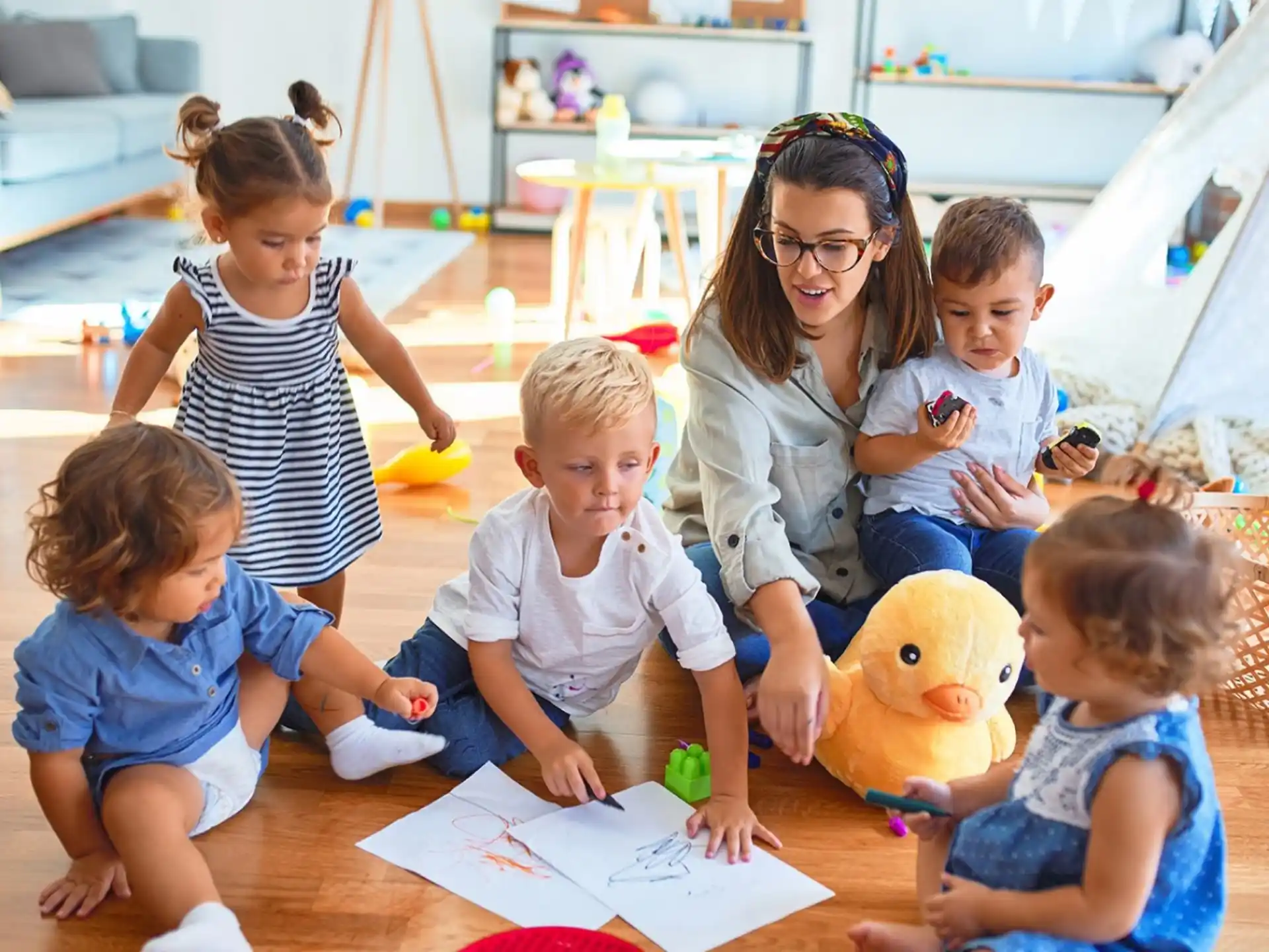 a group of children sitting on the floor