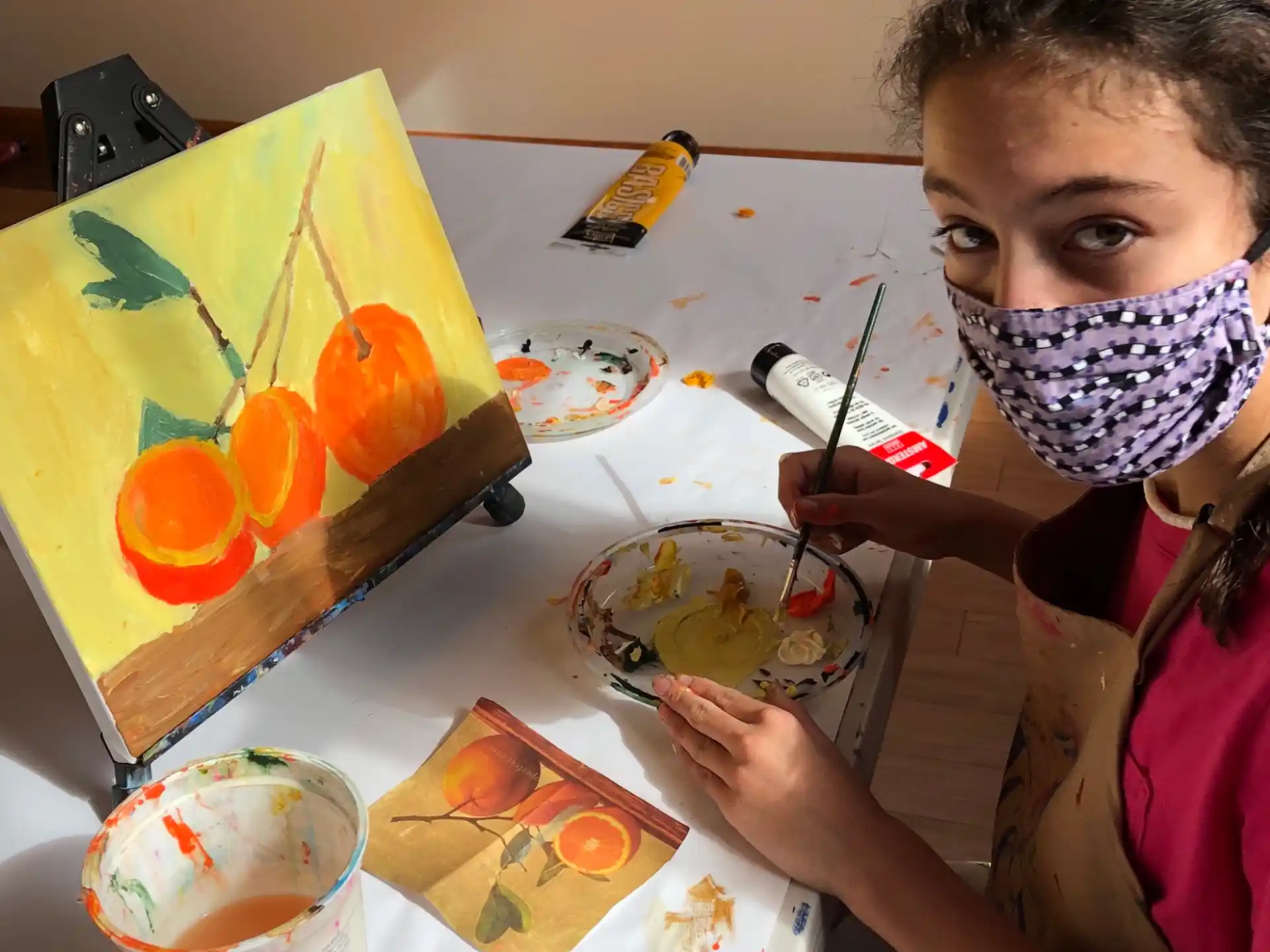 a girl painting on a table