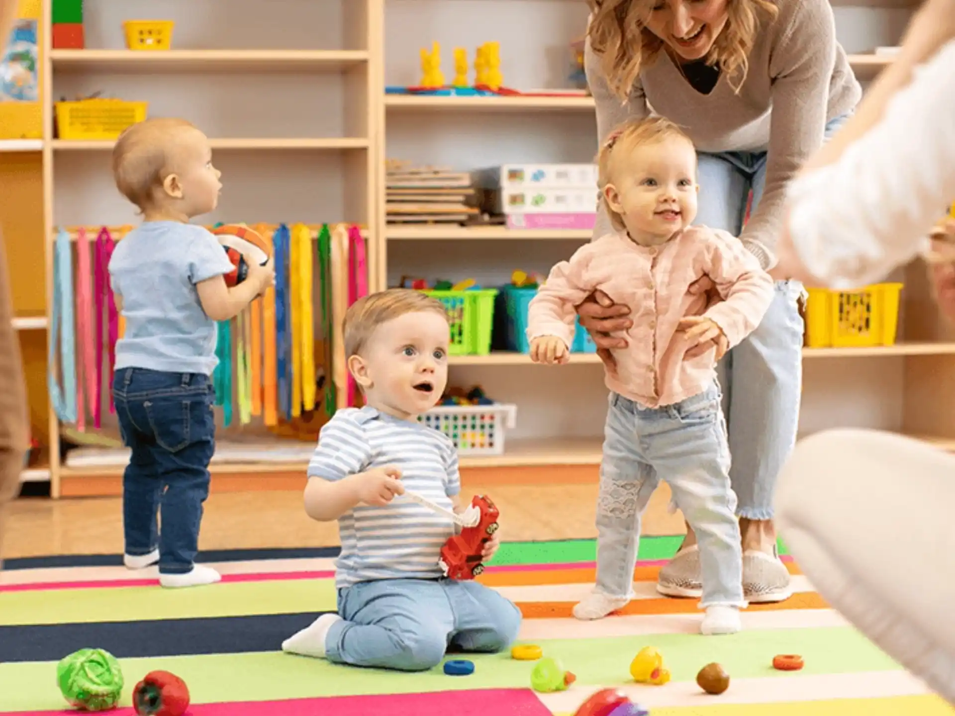 a group of children playing with toys