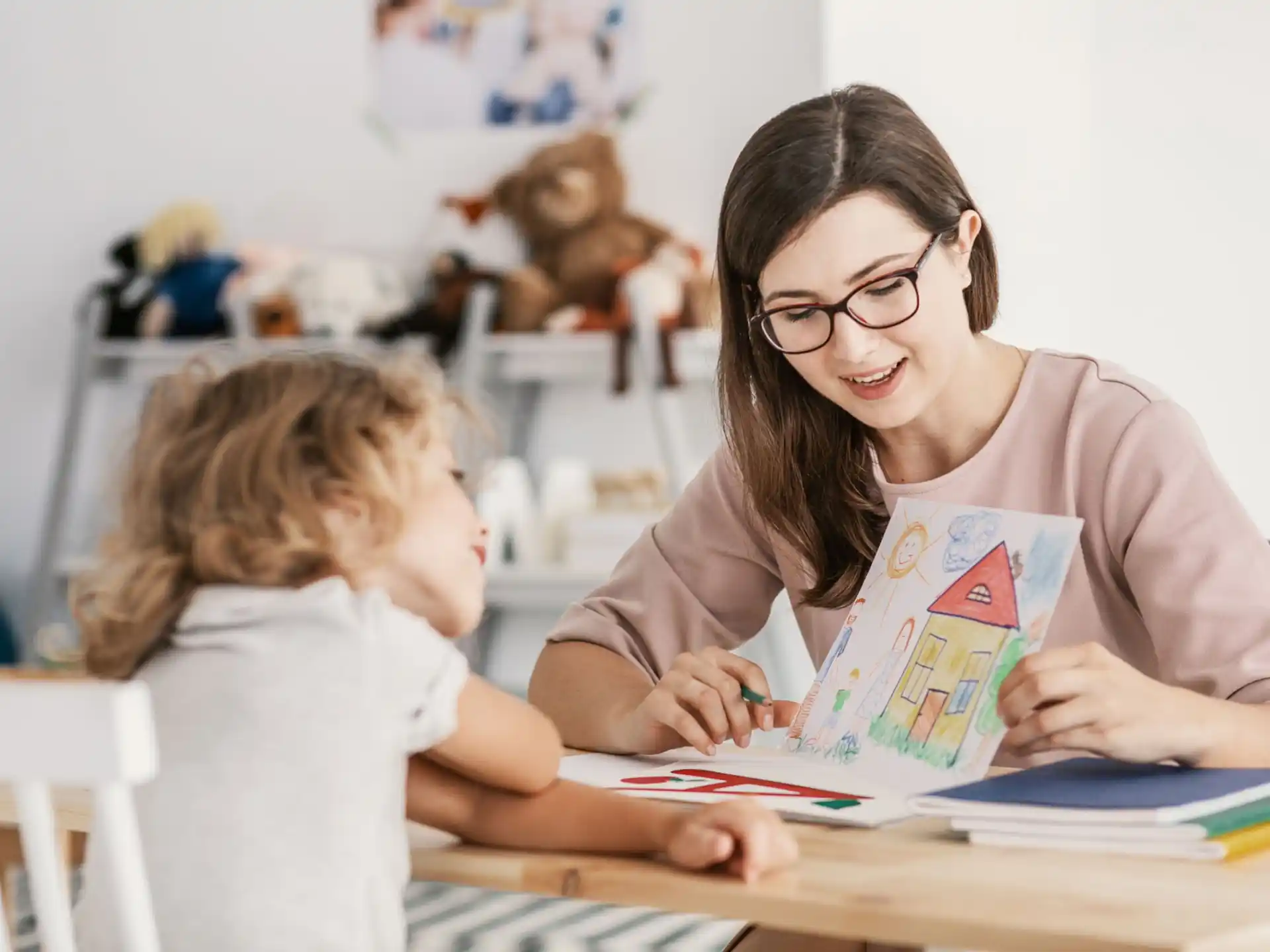 a person and a child reading a book