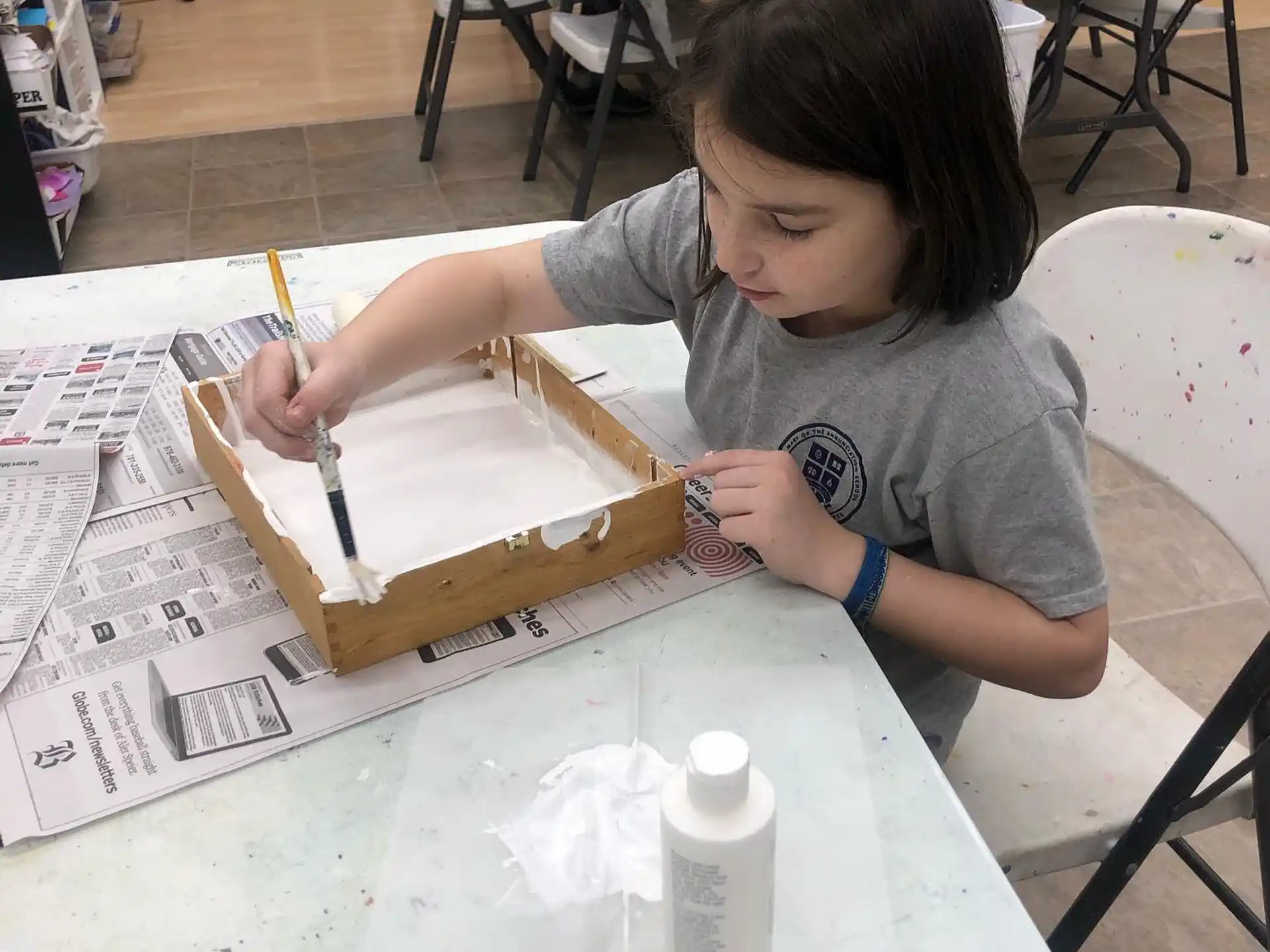 a person painting on a table
