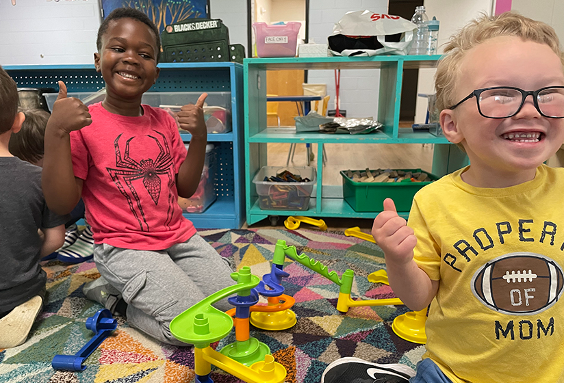 a couple of kids playing with toys