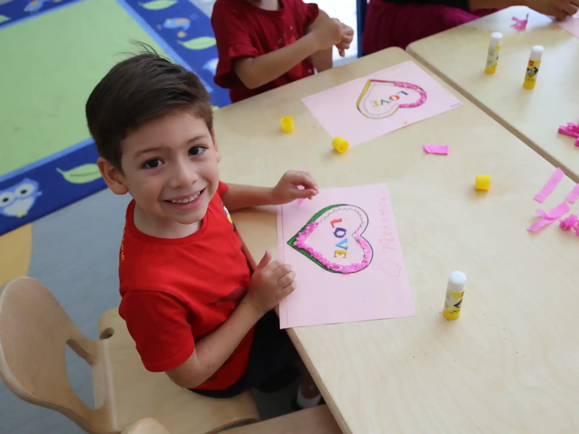 a boy sitting at a table