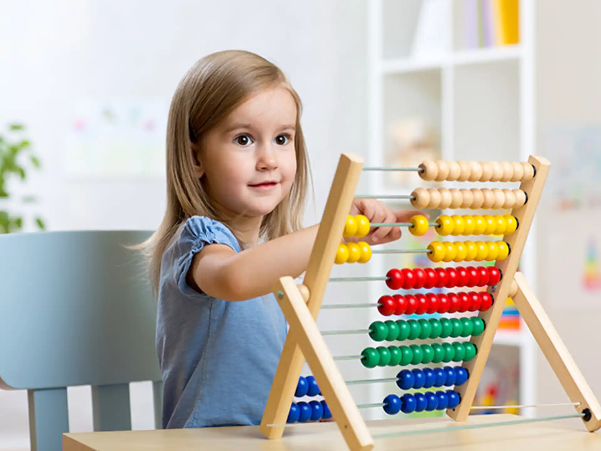 a girl holding a toy